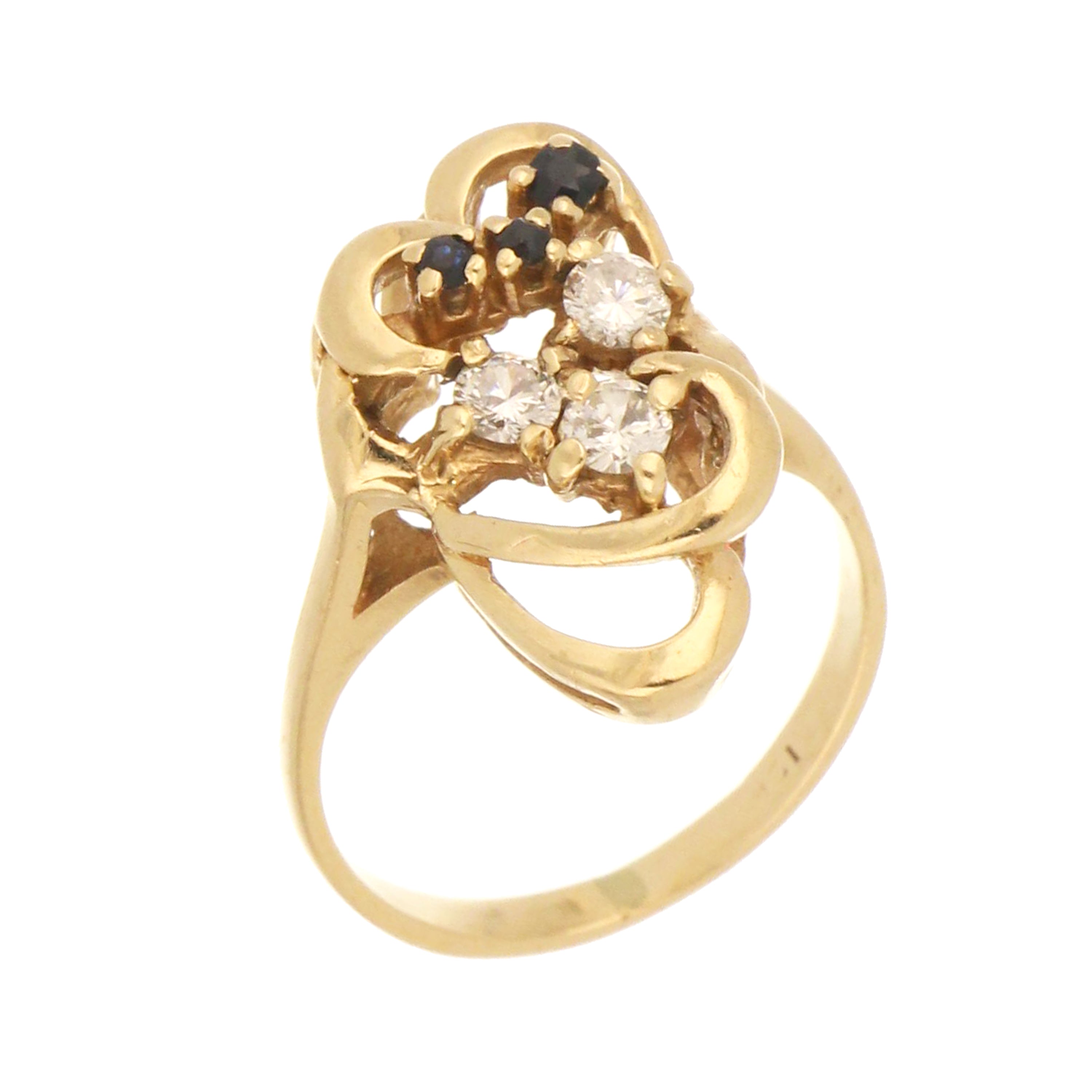 Elegant 10kt yellow gold ring with sapphire and cubic zirconia stones. Vintage swirl design, size 5.75. Pre-owned, sold as is.