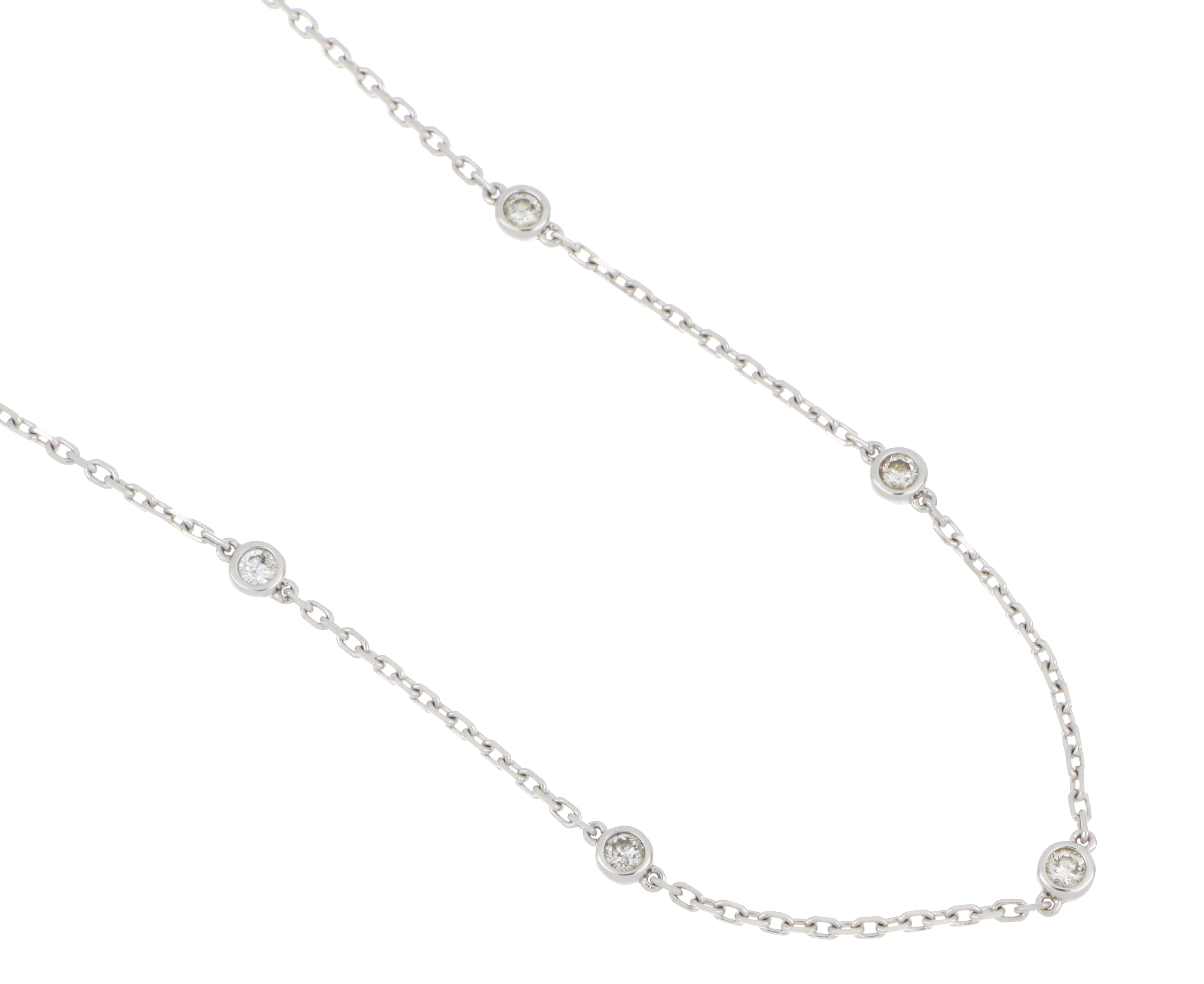 14kt white gold diamond necklace with 13 bezel-set stones, pre-owned