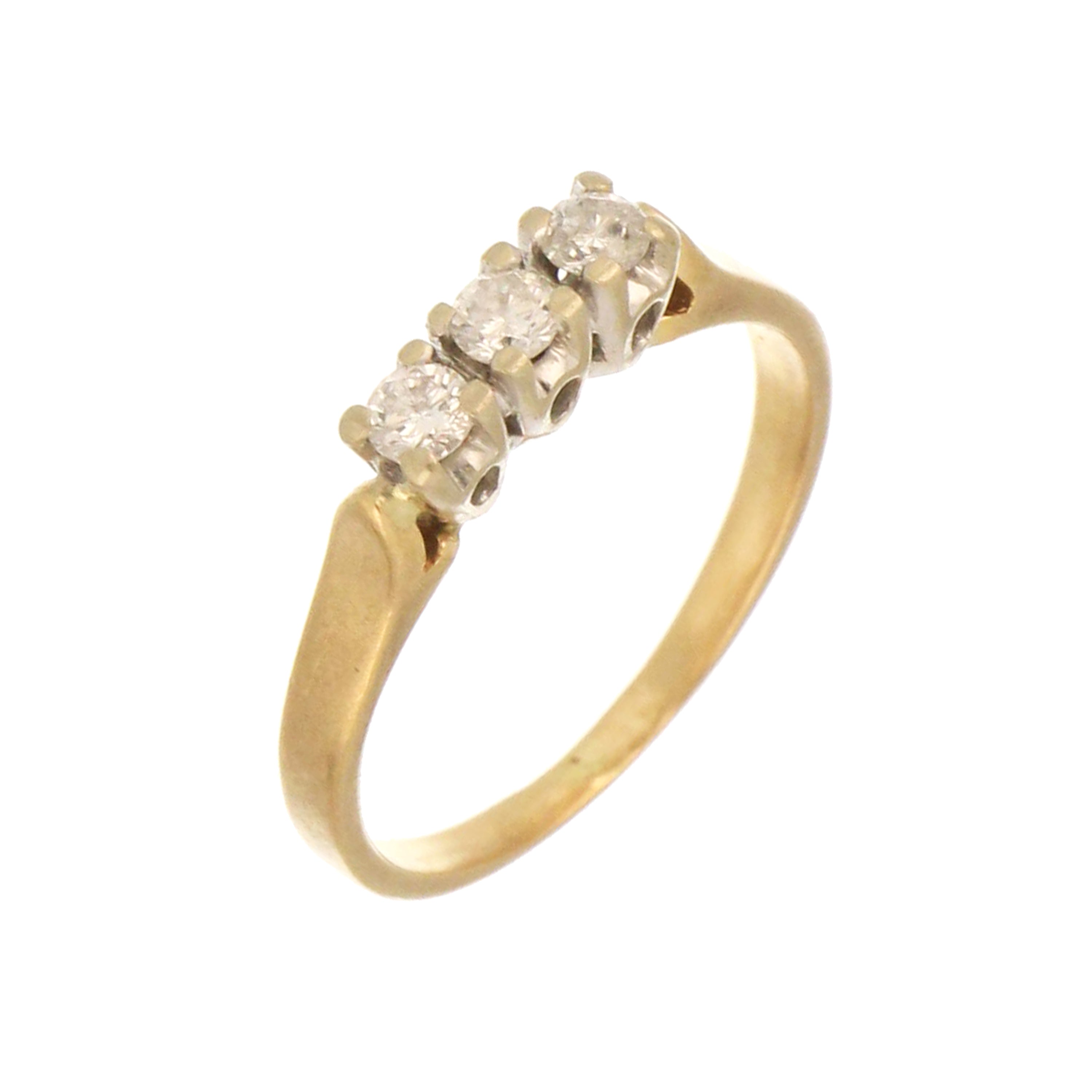 Classic gold band featuring three diamonds in white gold prong settings.