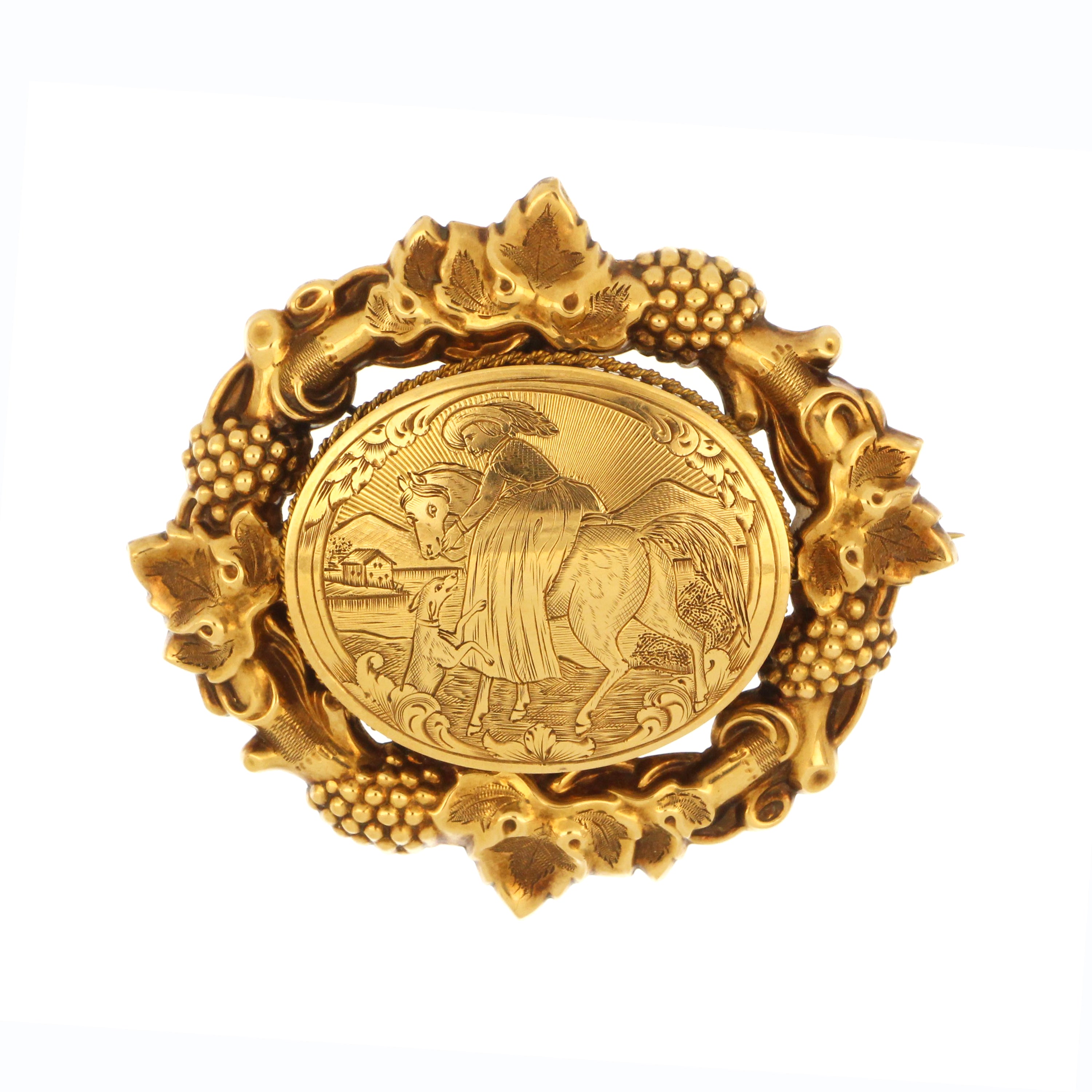 Antique 15K yellow gold brooch with engraved horse motif and ornate grapevine border, 22.6g.