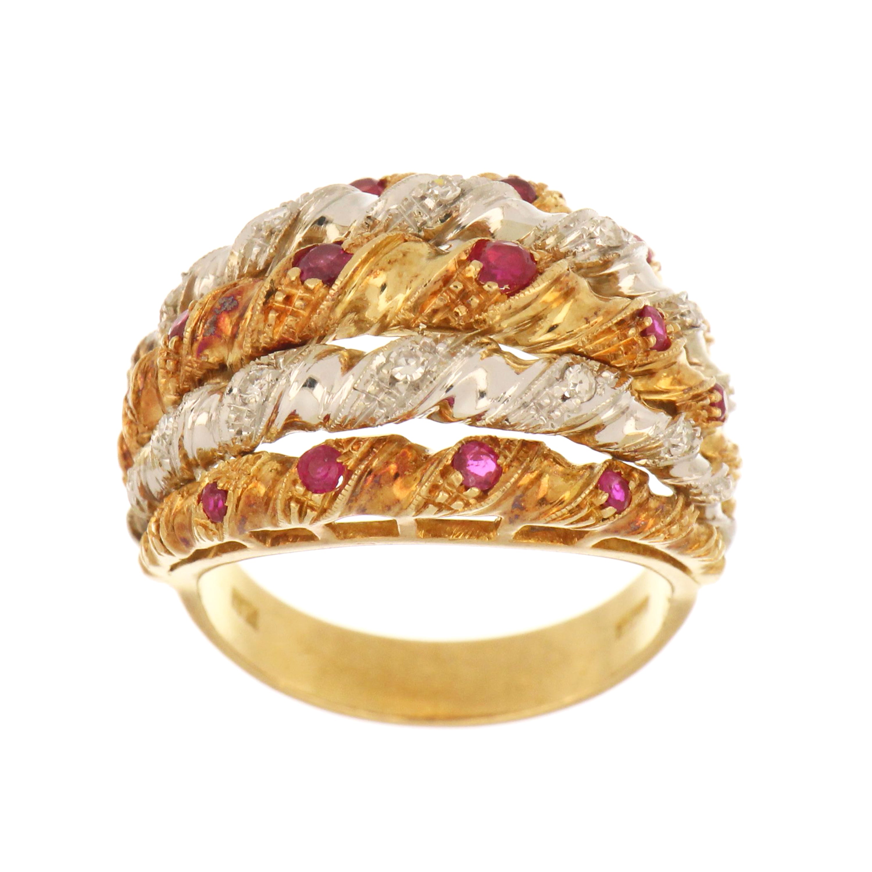 18kt yellow and white gold band ring with red rubies and single-cut diamonds.