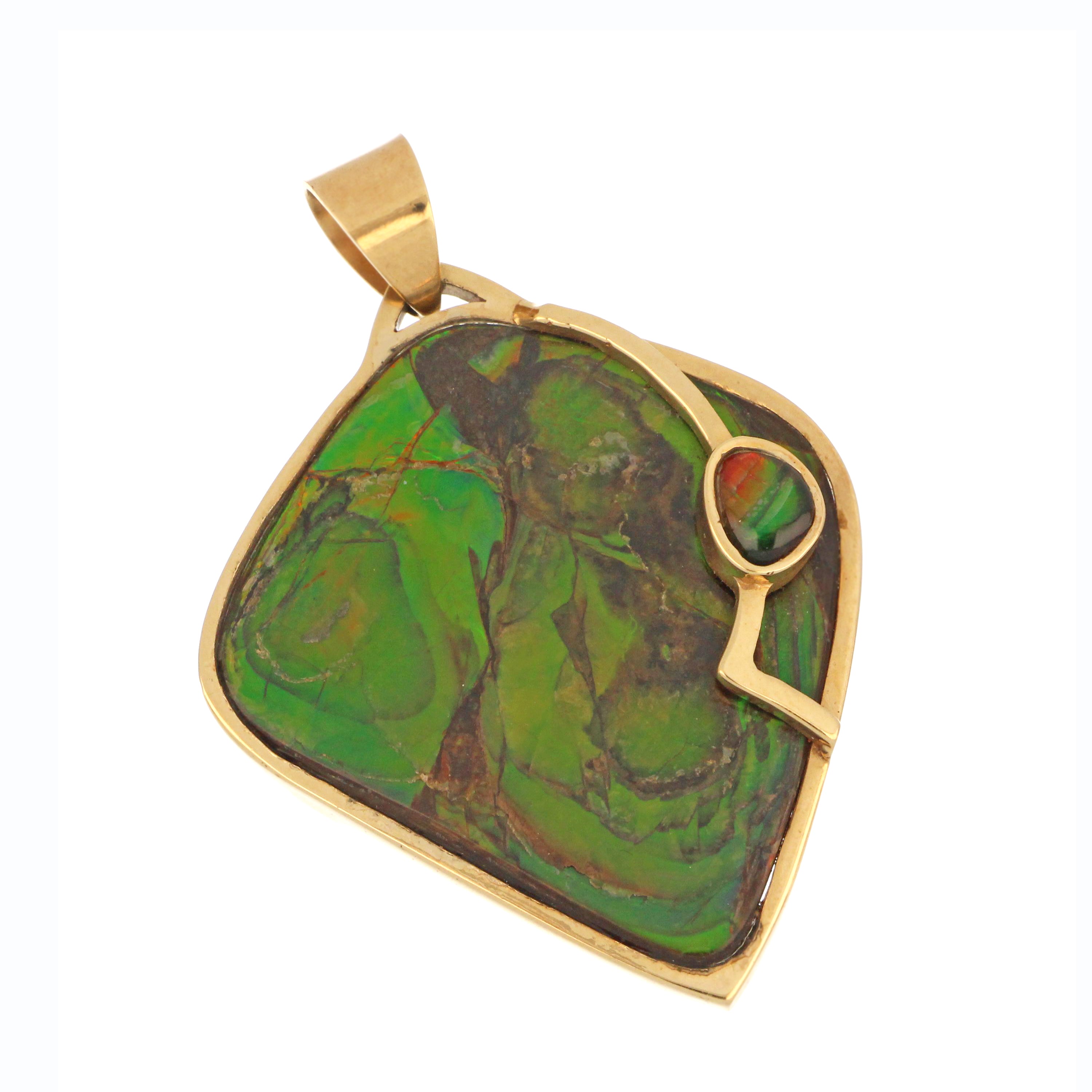 14kt yellow gold pendant with unique shaped natural ammolite stone showing red and green hues, front angle
