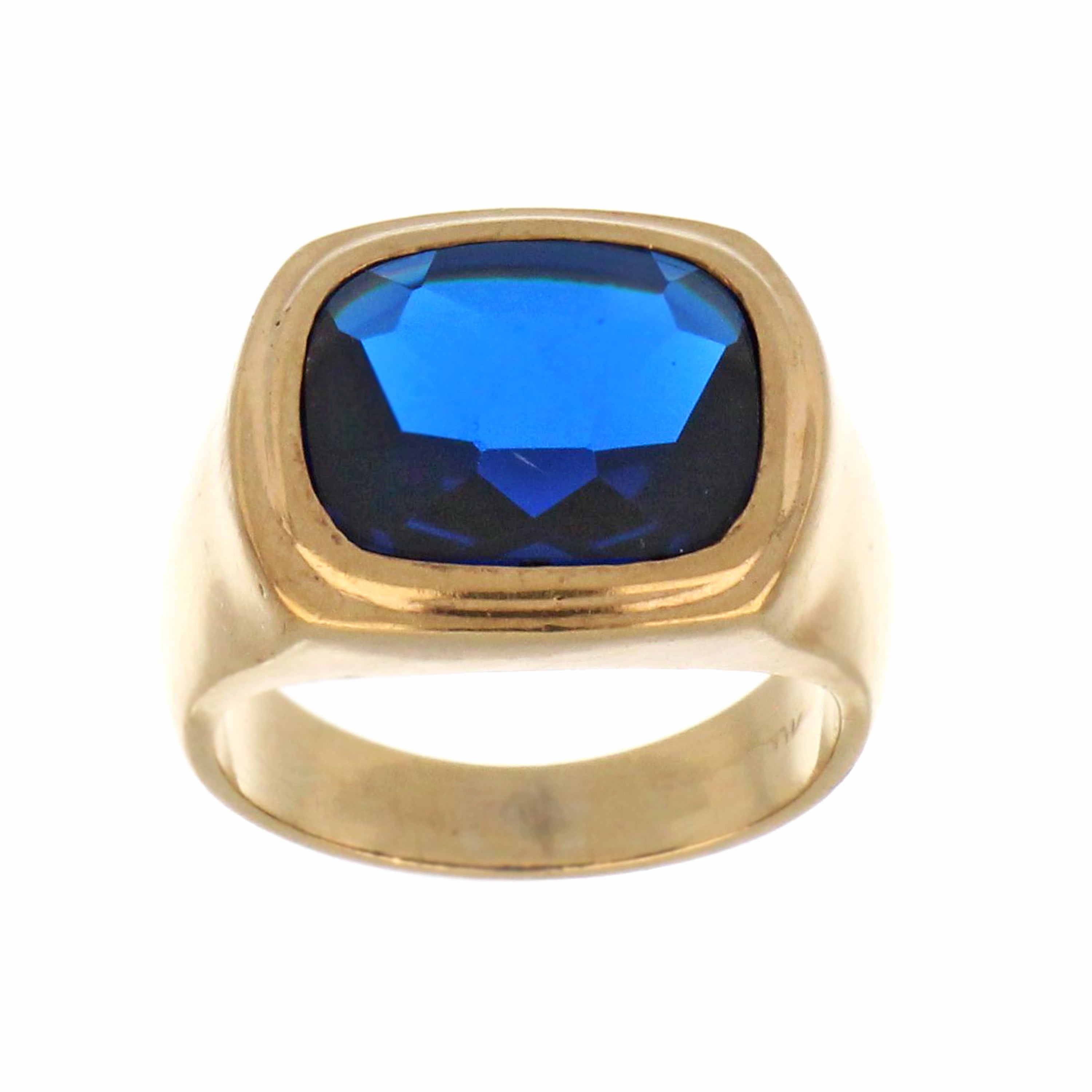 Close-up of 10kt yellow gold ring band with blue synthetic stone, angled to highlight gemstone and gold texture, approx. 9.11 grams