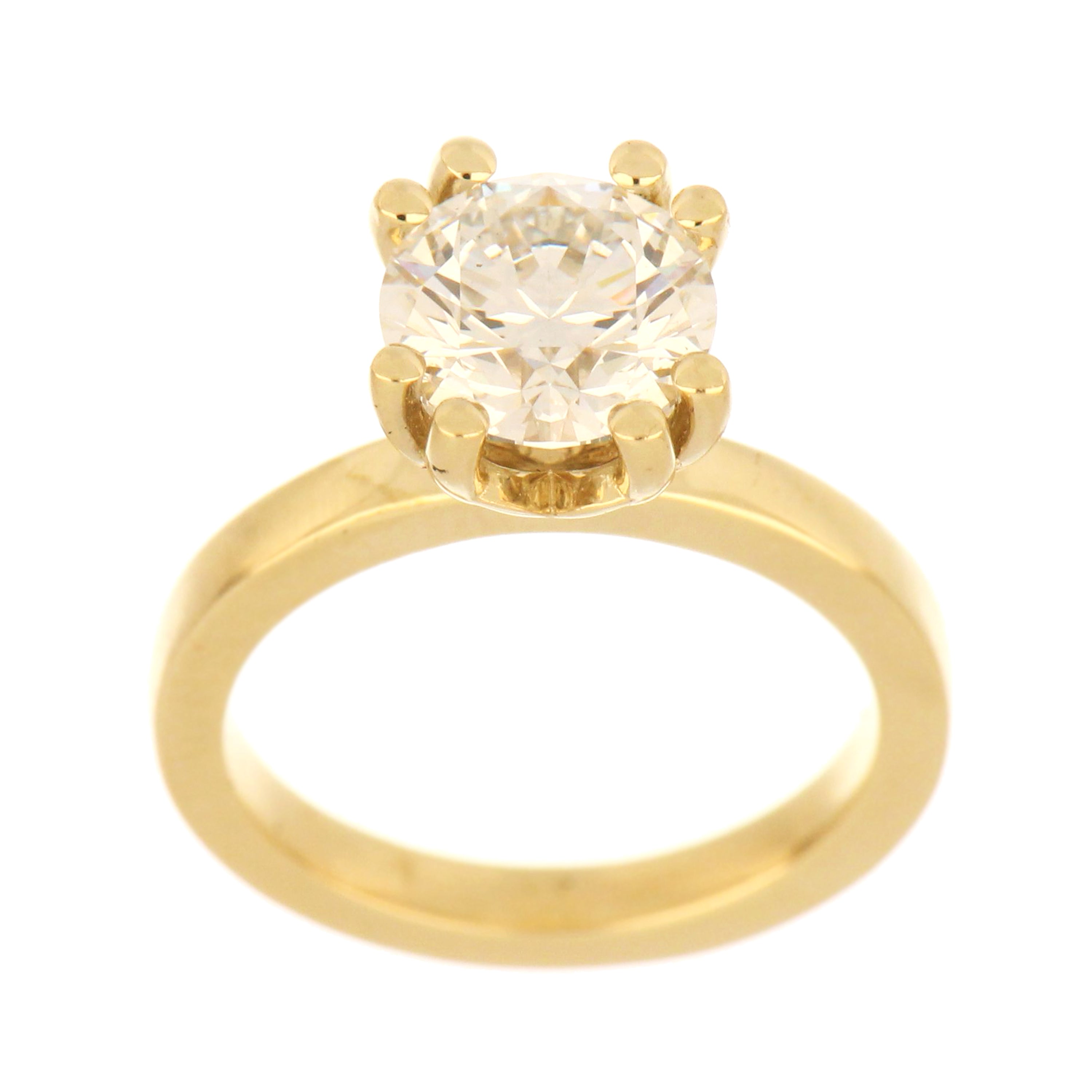 14kt yellow gold solitaire ring showcasing a round brilliant cut lab grown diamond, claw setting, top angle