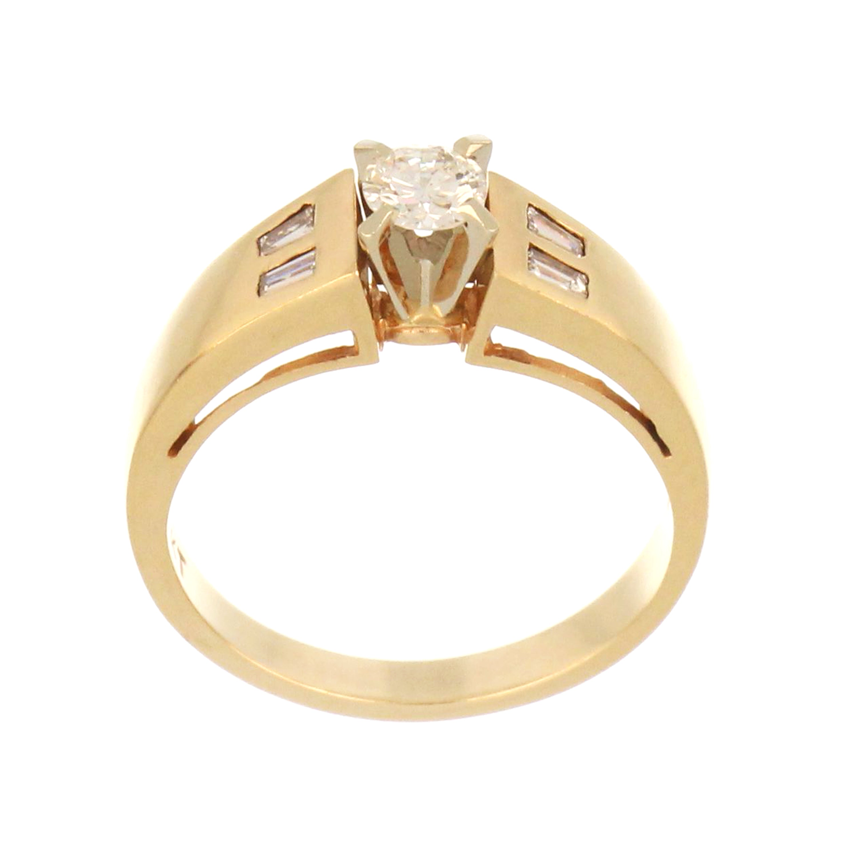 14kt yellow gold engagement ring with round brilliant cut center diamond and tapered baguette side diamonds, angled close-up