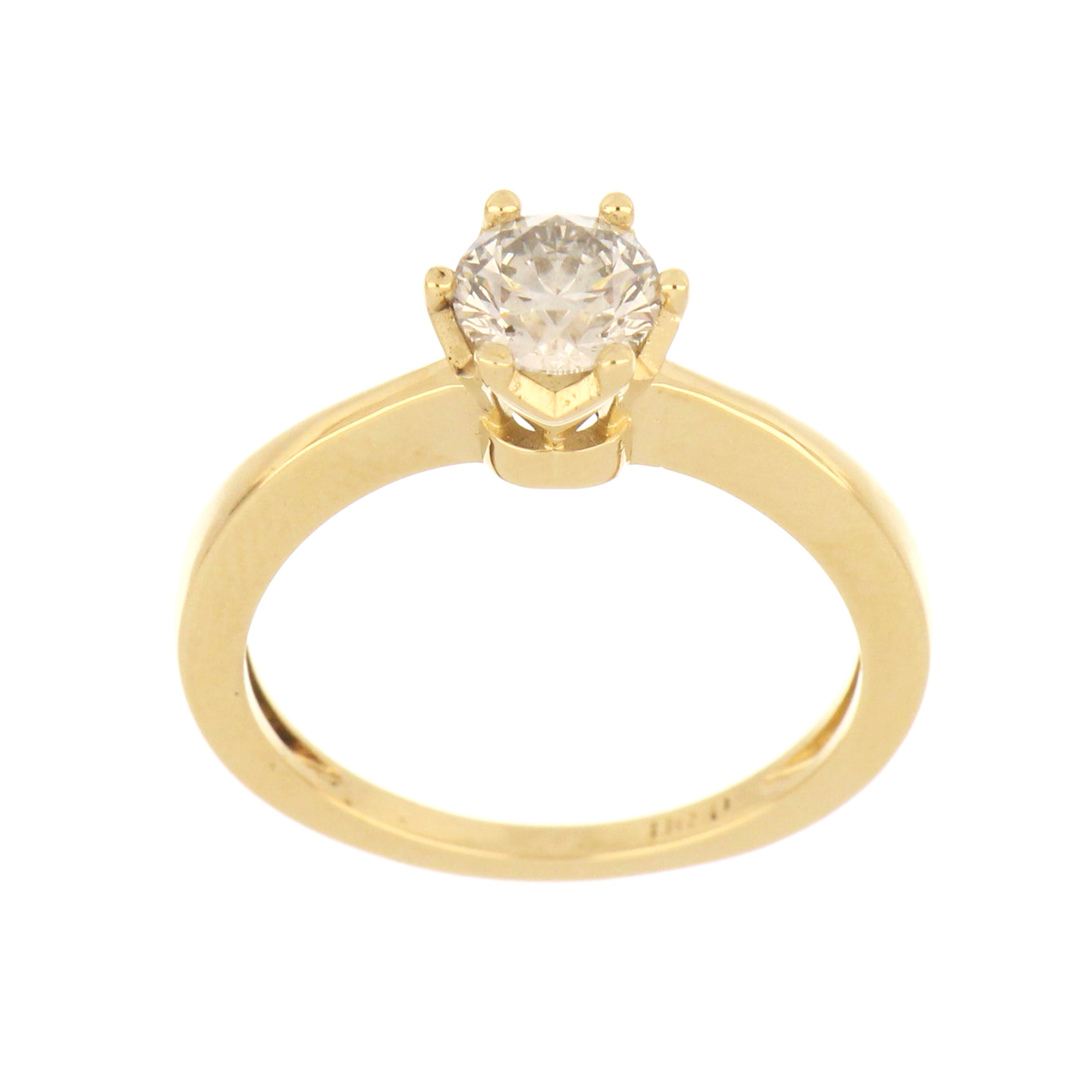 Close-up of 14kt yellow gold solitaire ring featuring a round brilliant lab grown diamond in a six-claw setting