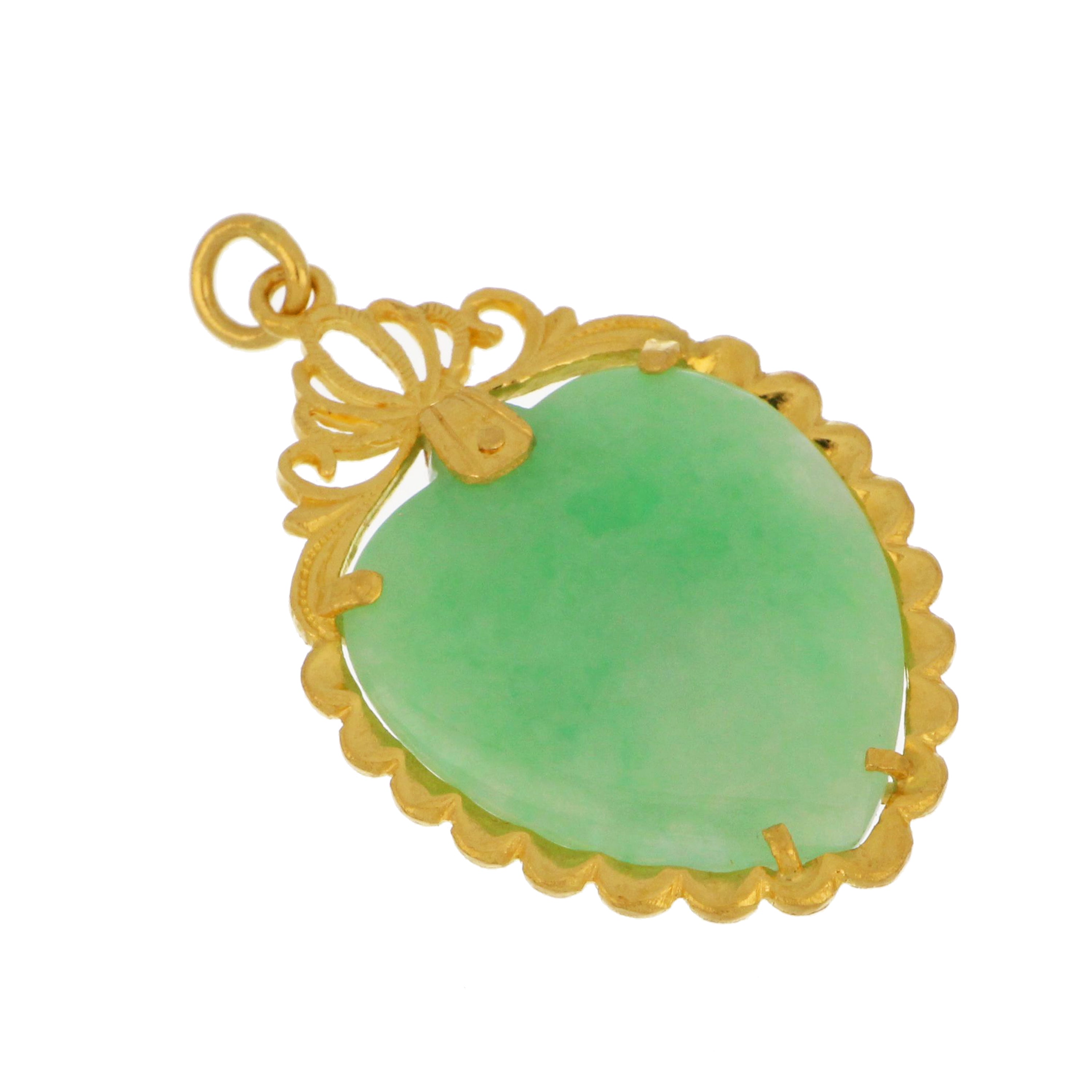 Close-up of 24kt yellow gold framed pendant with heart-shaped semi-transparent yellowish green jadeite jade