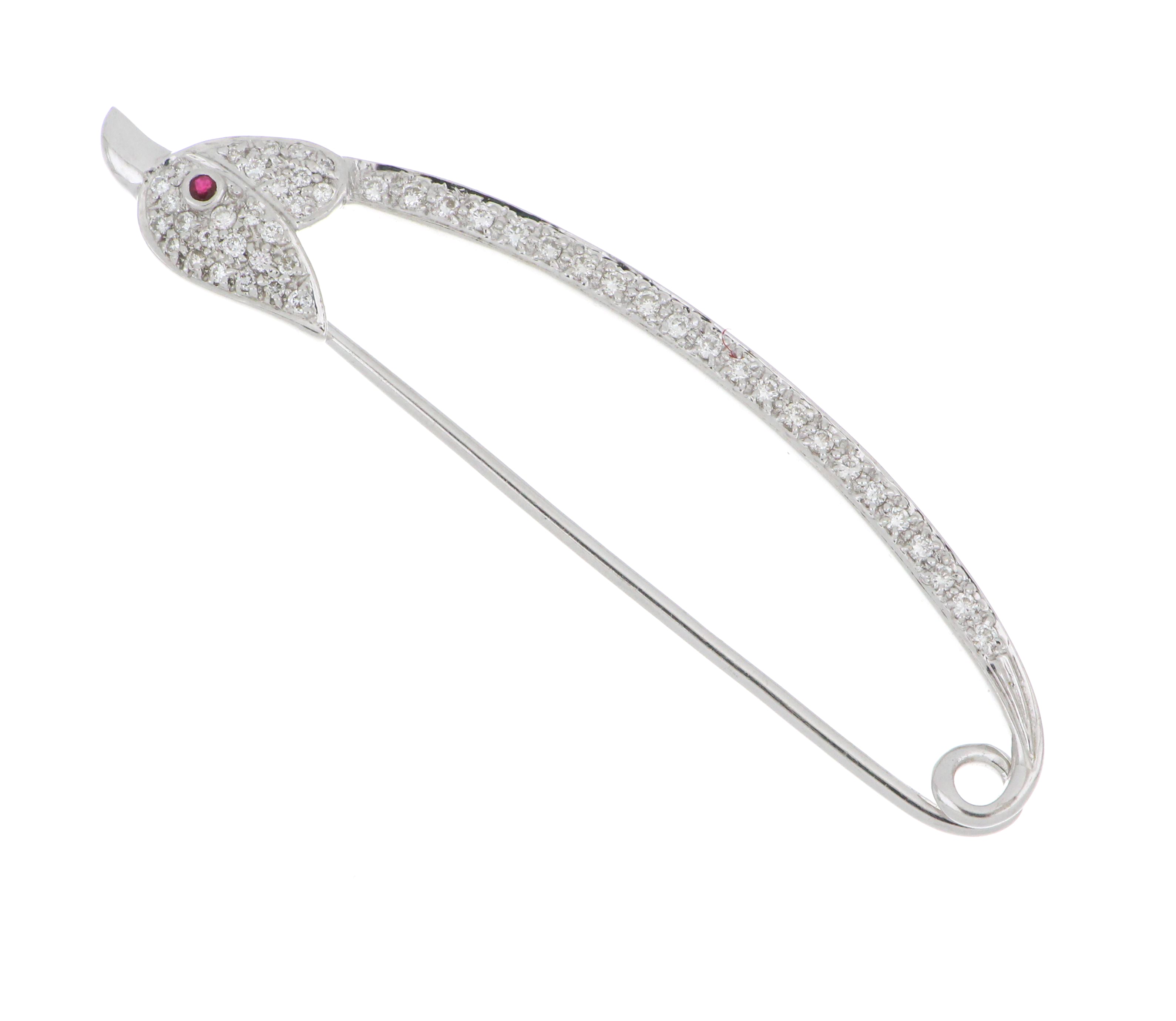 18kt white gold brooch in bird shape with diamond accents, shown from front angle, lightweight approximately 3.61 grams