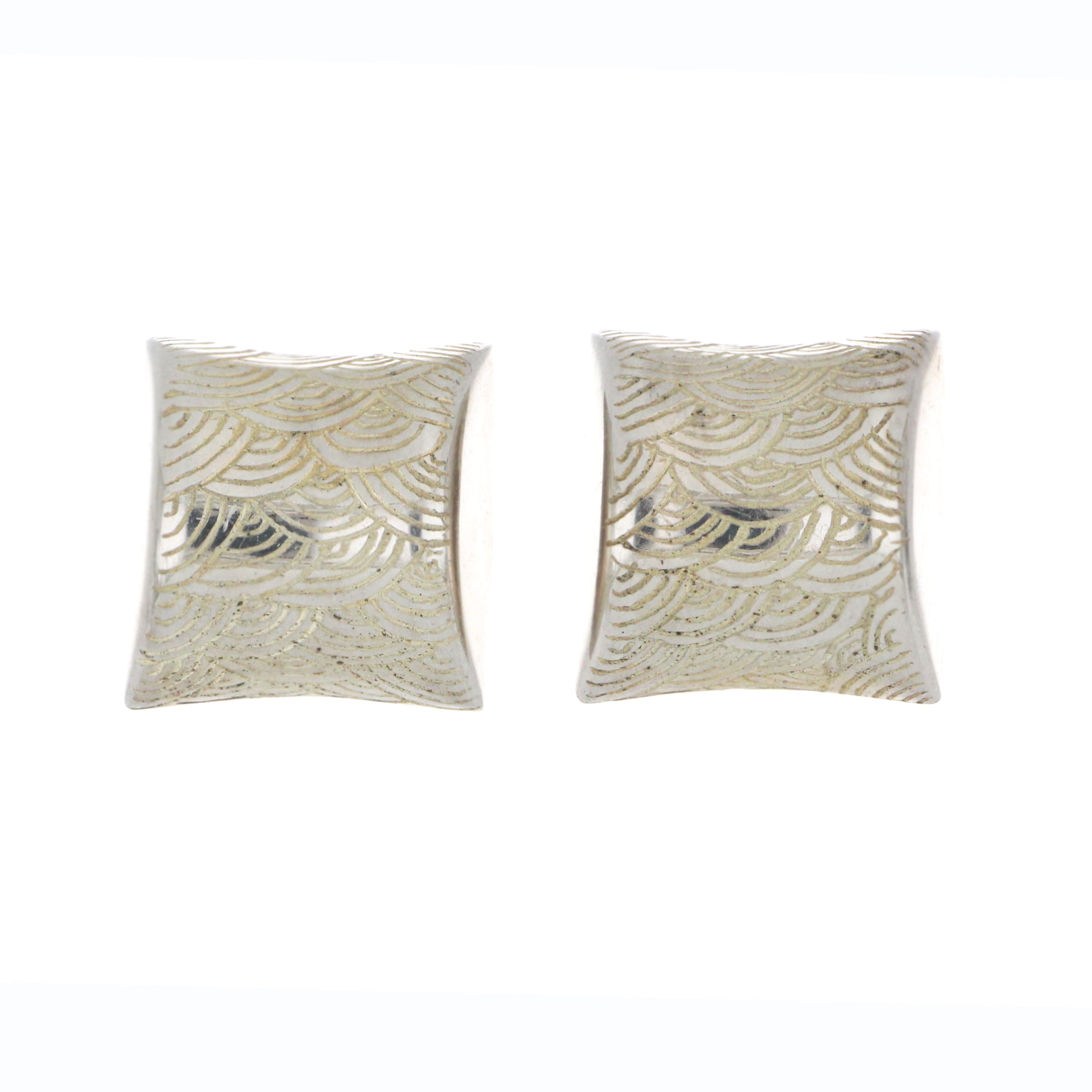 Sterling silver button style earring featuring detailed ocean wave motif, front angle, 13.19 grams