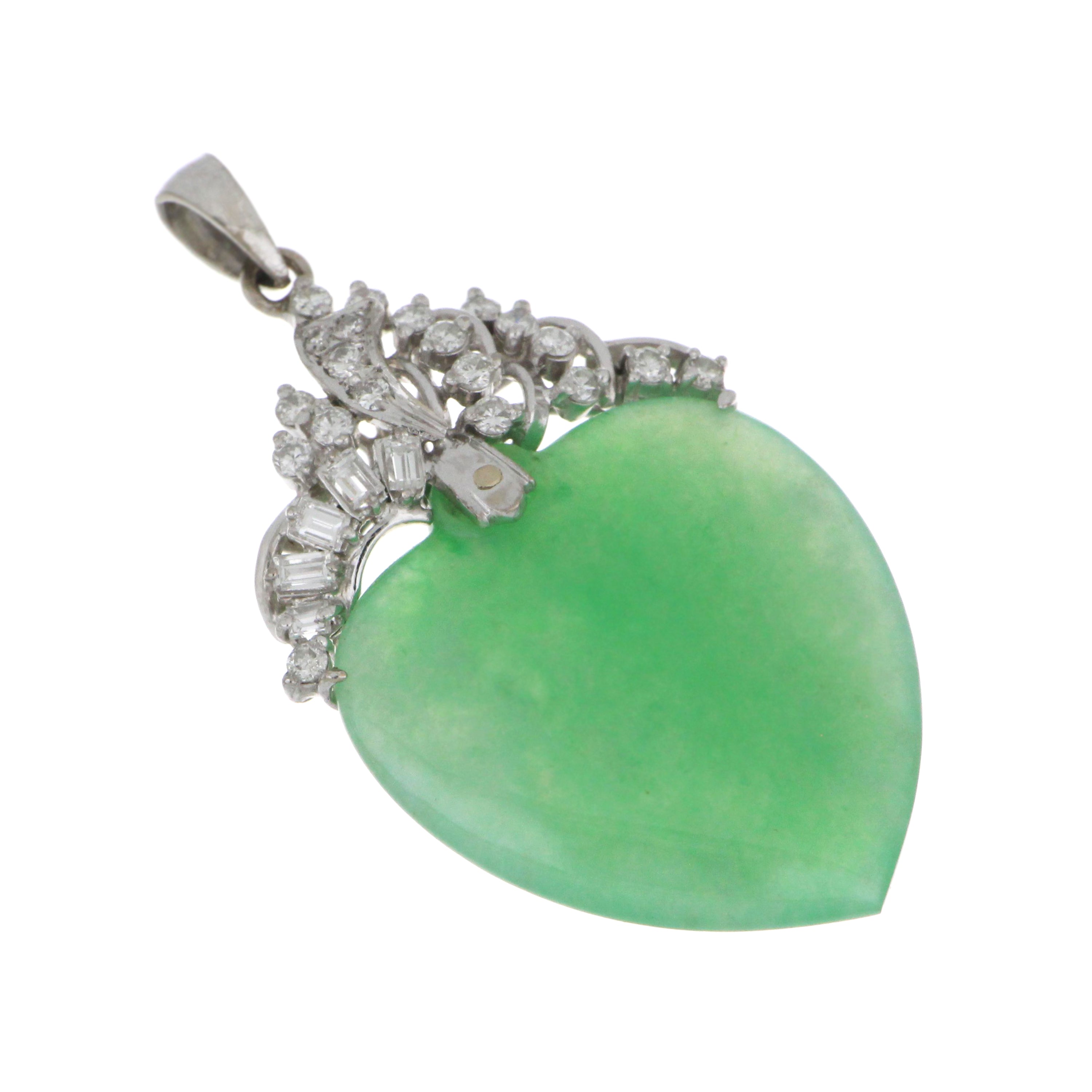 Close-up of 14kt white gold heart-shaped jadeite pendant with semi-transparent green jade and surrounding round and baguette diamonds