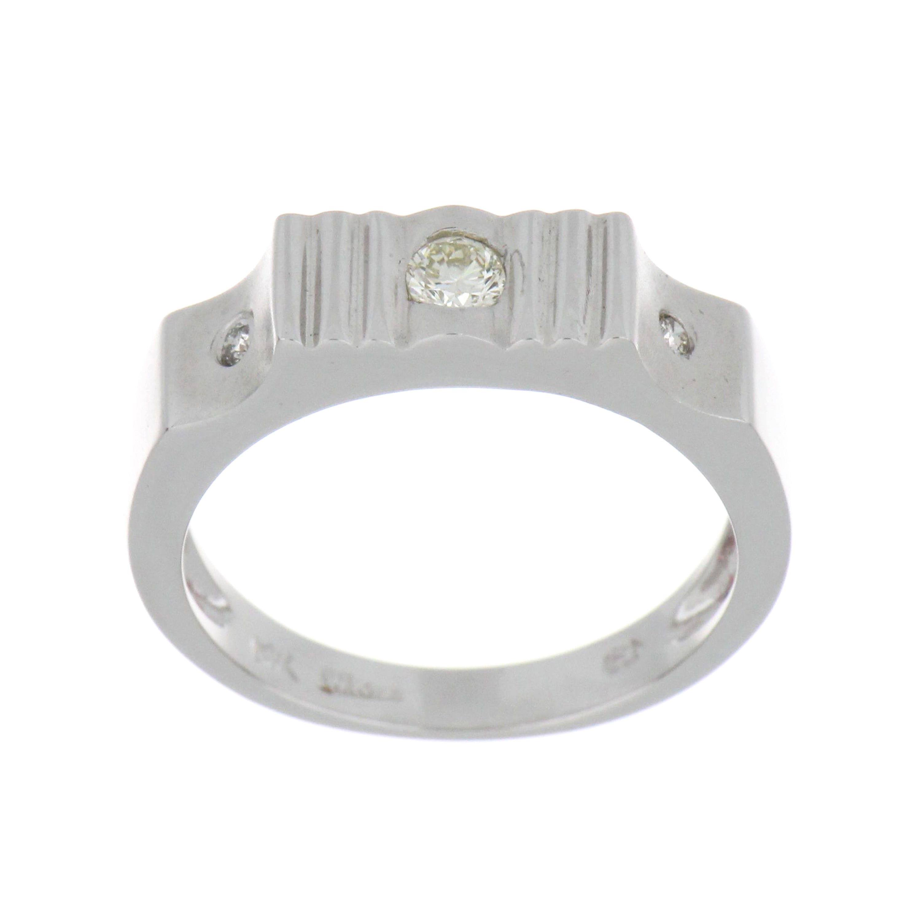 14kt white gold diamond ring featuring a 0.10ct round brilliant cut diamond with two smaller round side diamonds, viewed top angle