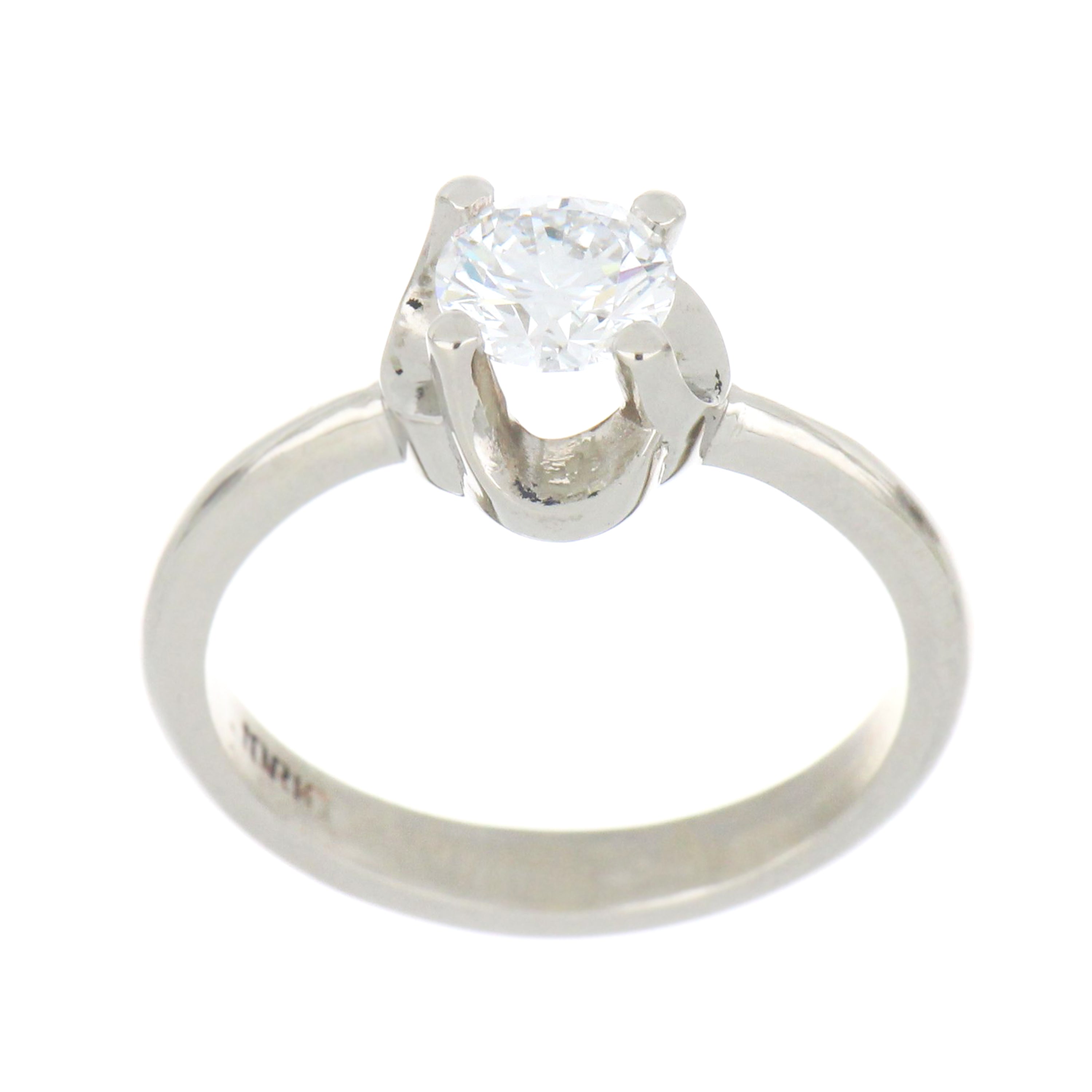 14kt white gold solitaire ring with round brilliant cut lab grown diamond viewed from side showing claw setting