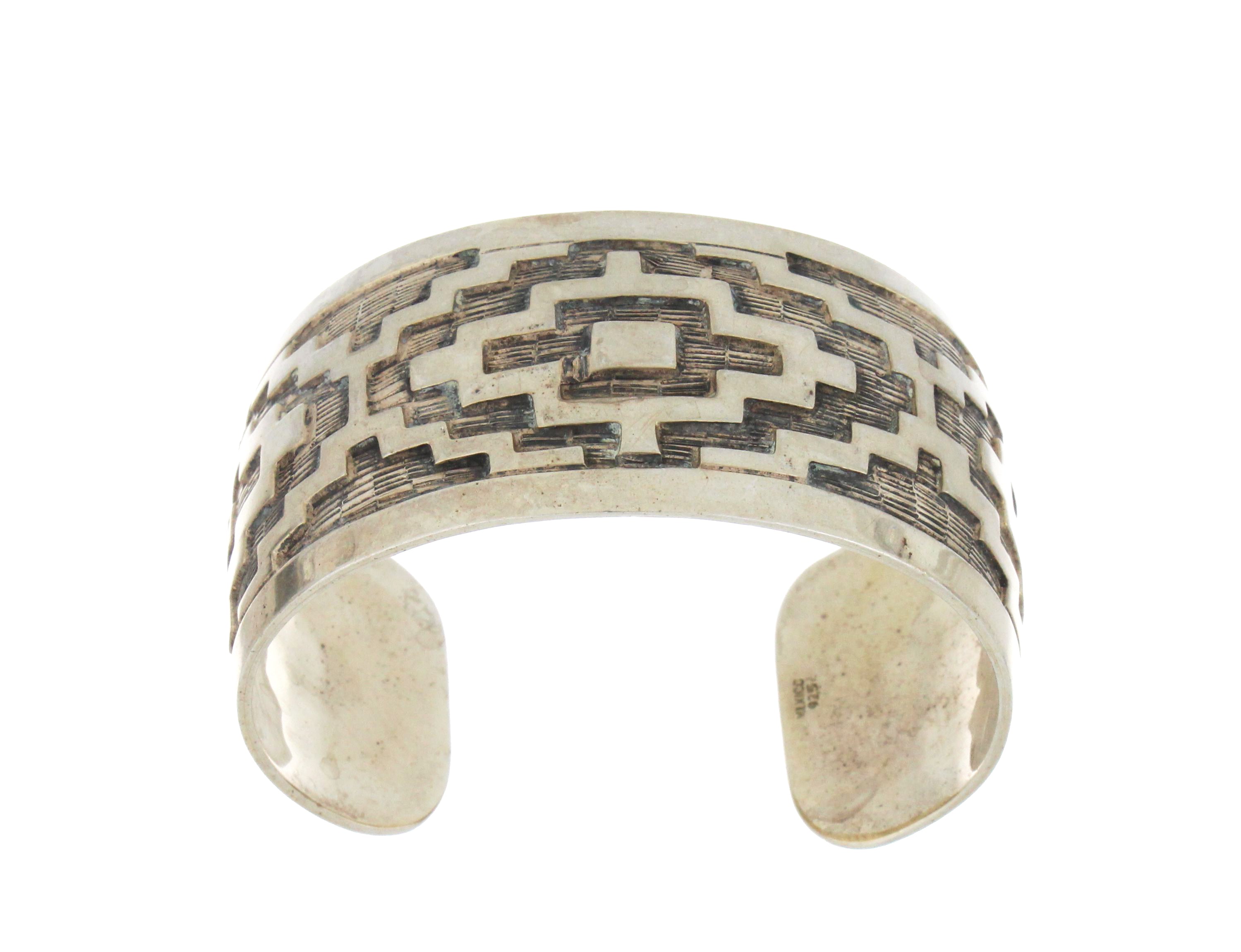 Side profile of sterling silver open back bangle showing smooth polished finish and open back design