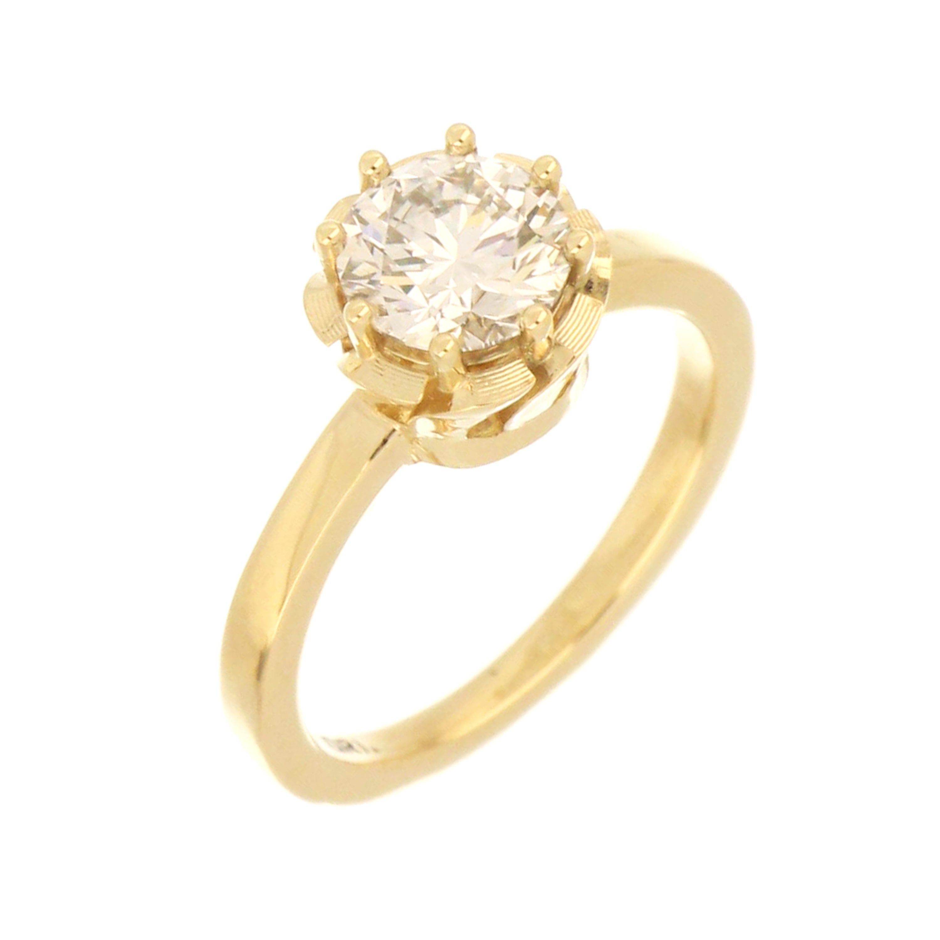 Close-up of 14kt yellow gold 8-claw setting holding 1.35ct brilliant round lab grown diamond