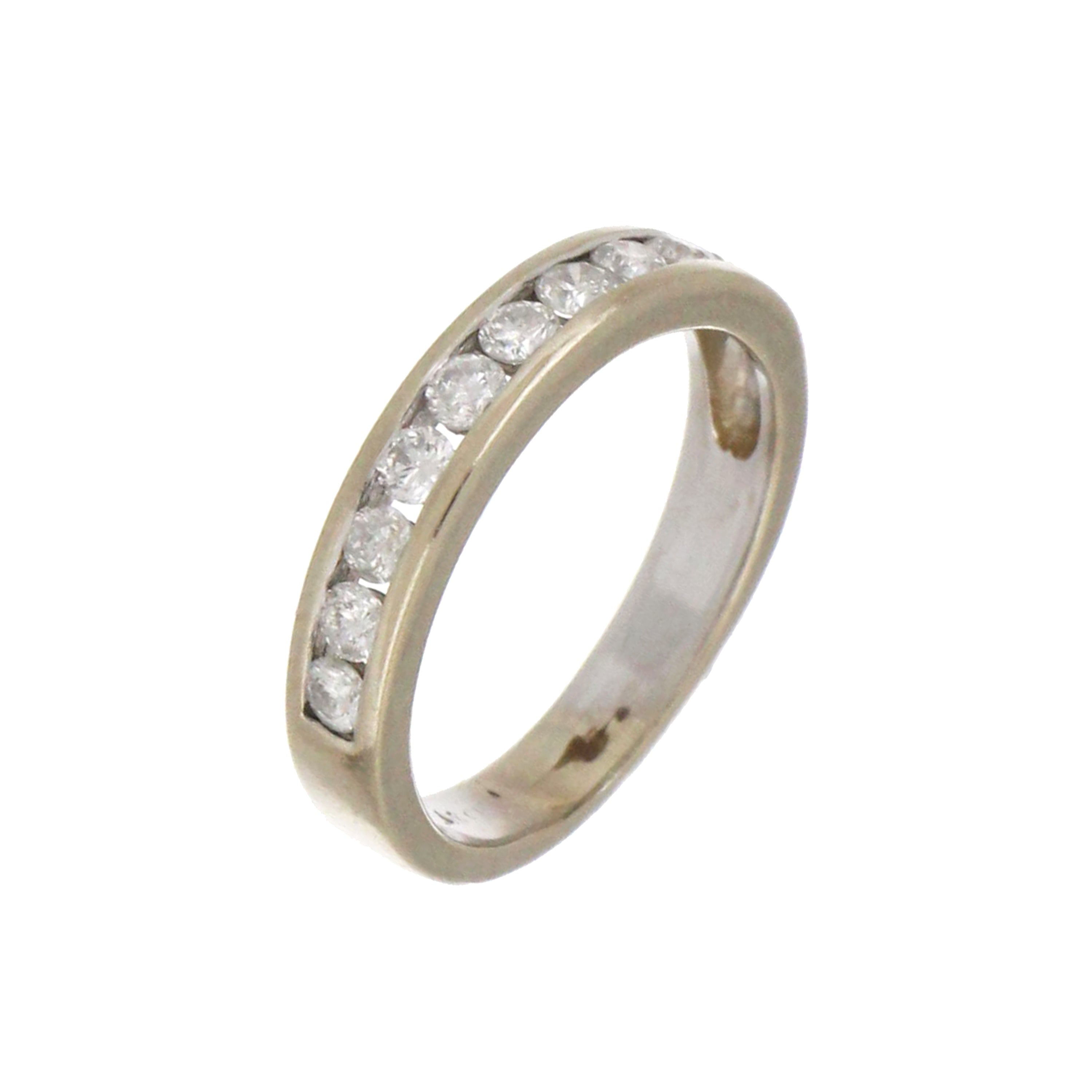 Close-up angled image of 10kt white gold diamond band ring highlighting 10 round diamonds and intricate setting