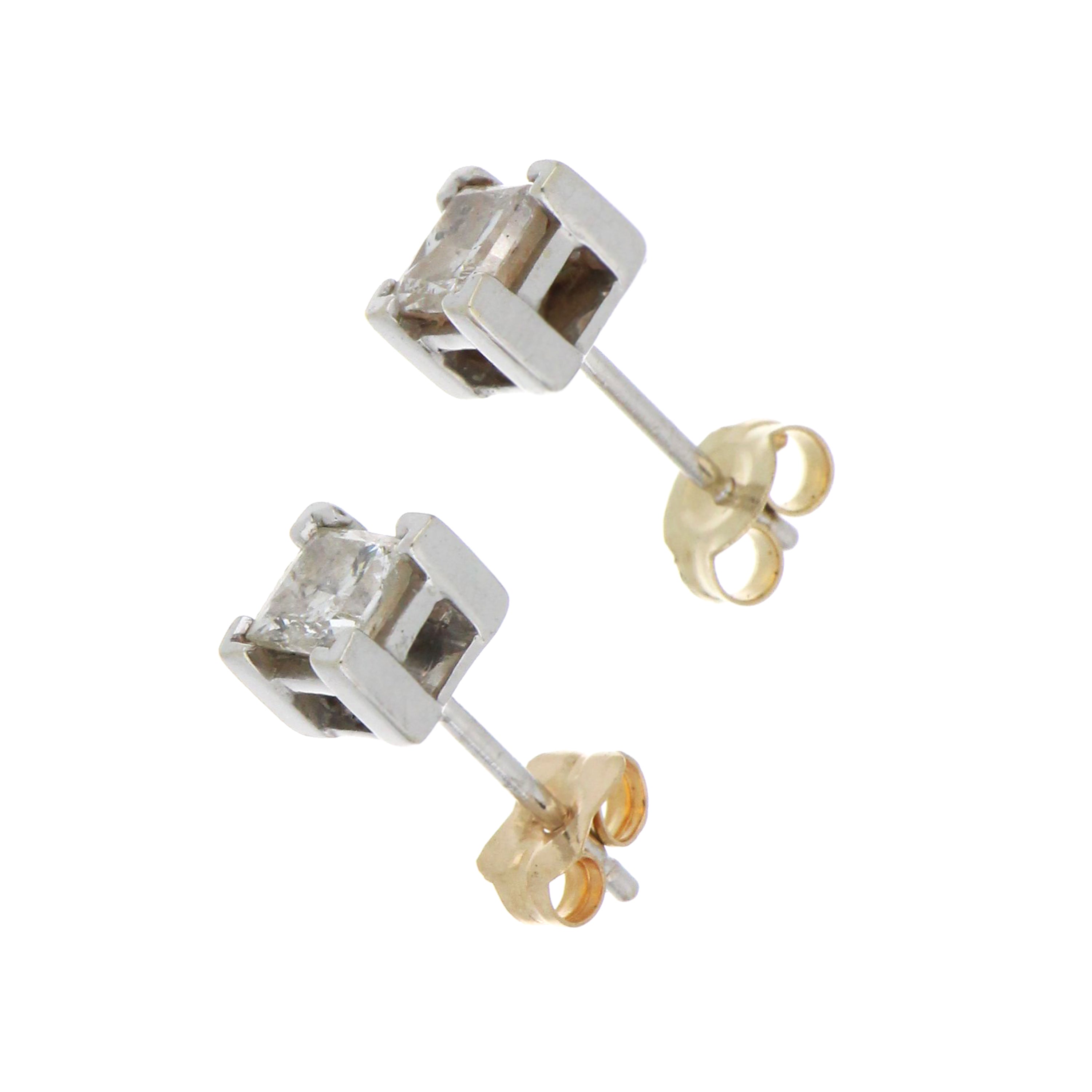 Side view of 14kt white gold stud diamond earring with yellow gold backing, highlighting setting detail