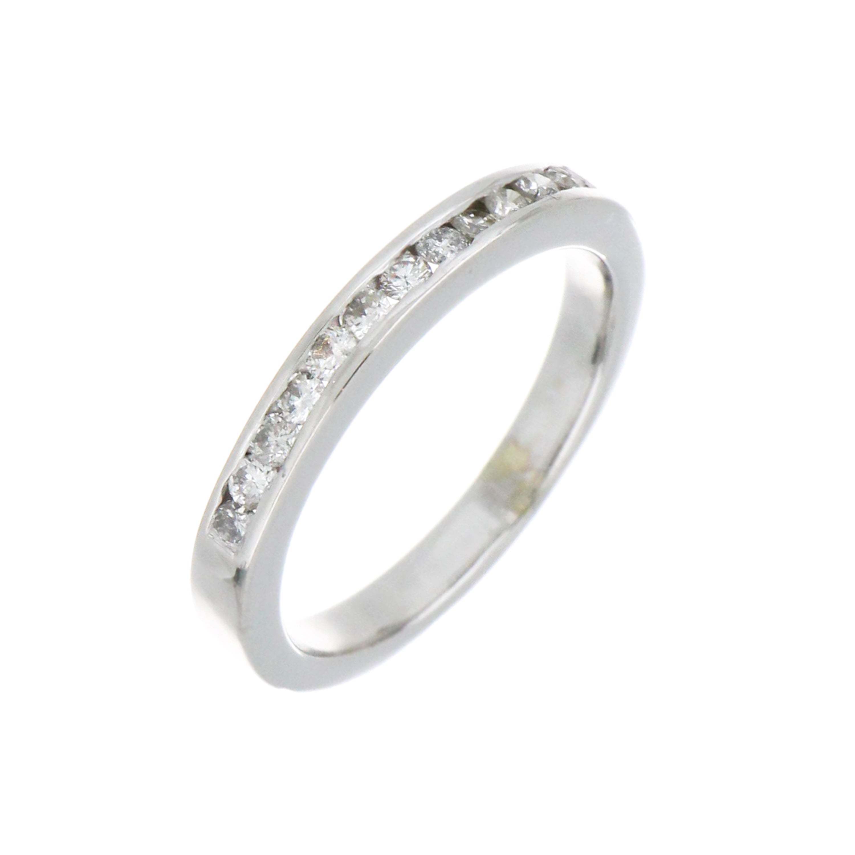 Side angle of 19kt white gold diamond band displaying channel set full cut diamonds and smooth finish