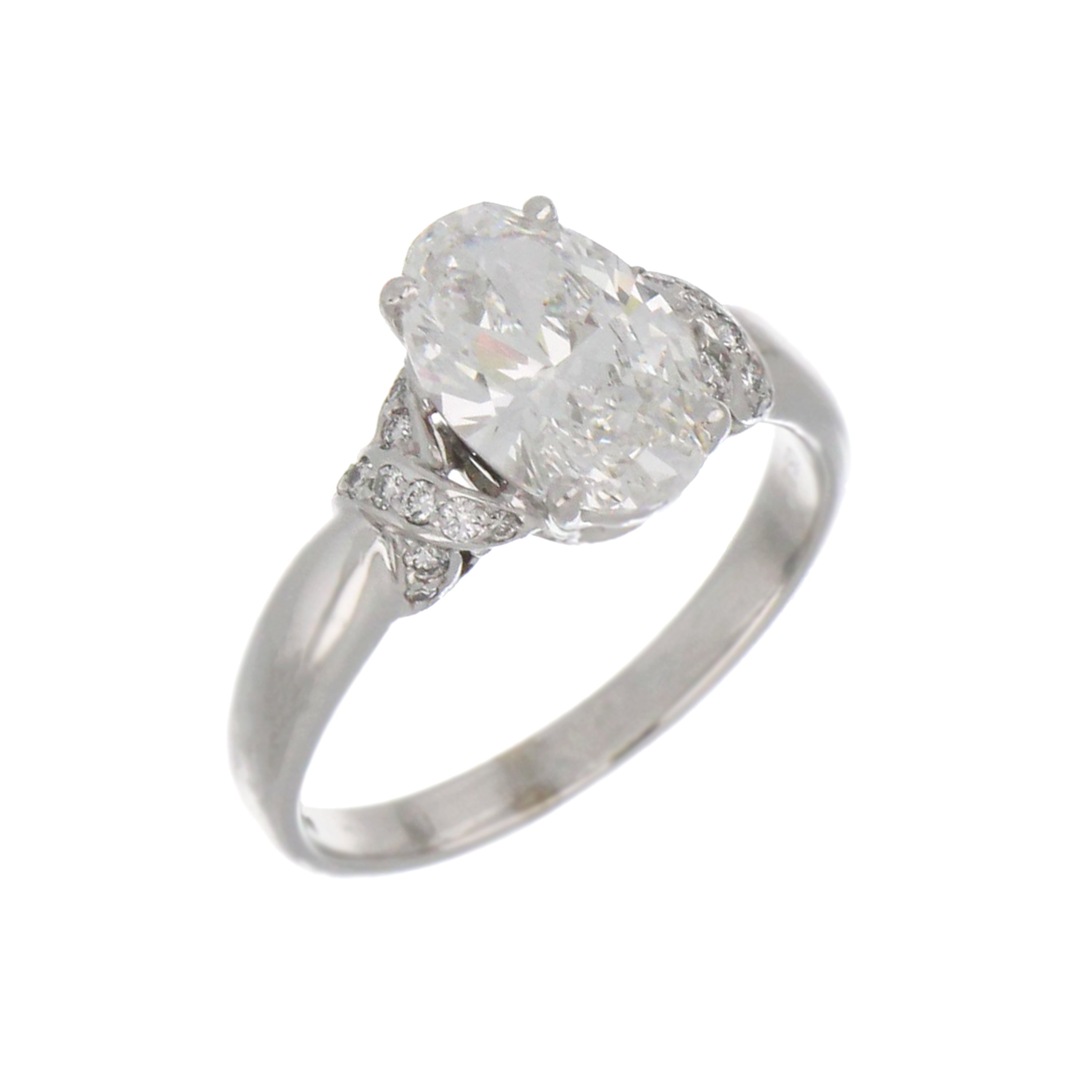 Elegant white gold band ring with oval diamond and side round diamonds in claw setting, ring size 8.5