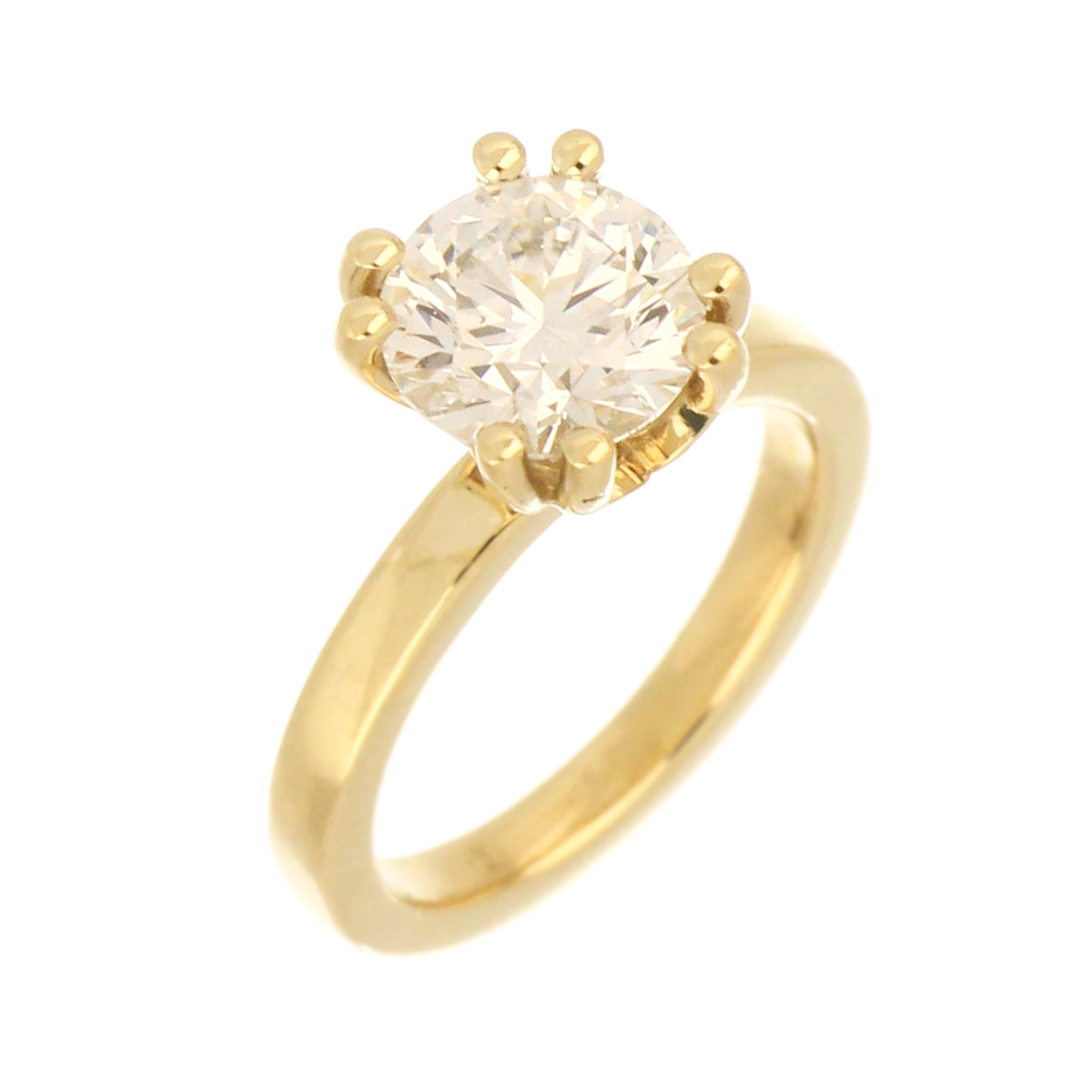 Side profile of 14kt yellow gold solitaire diamond ring highlighting double 4-claw setting and polished shank