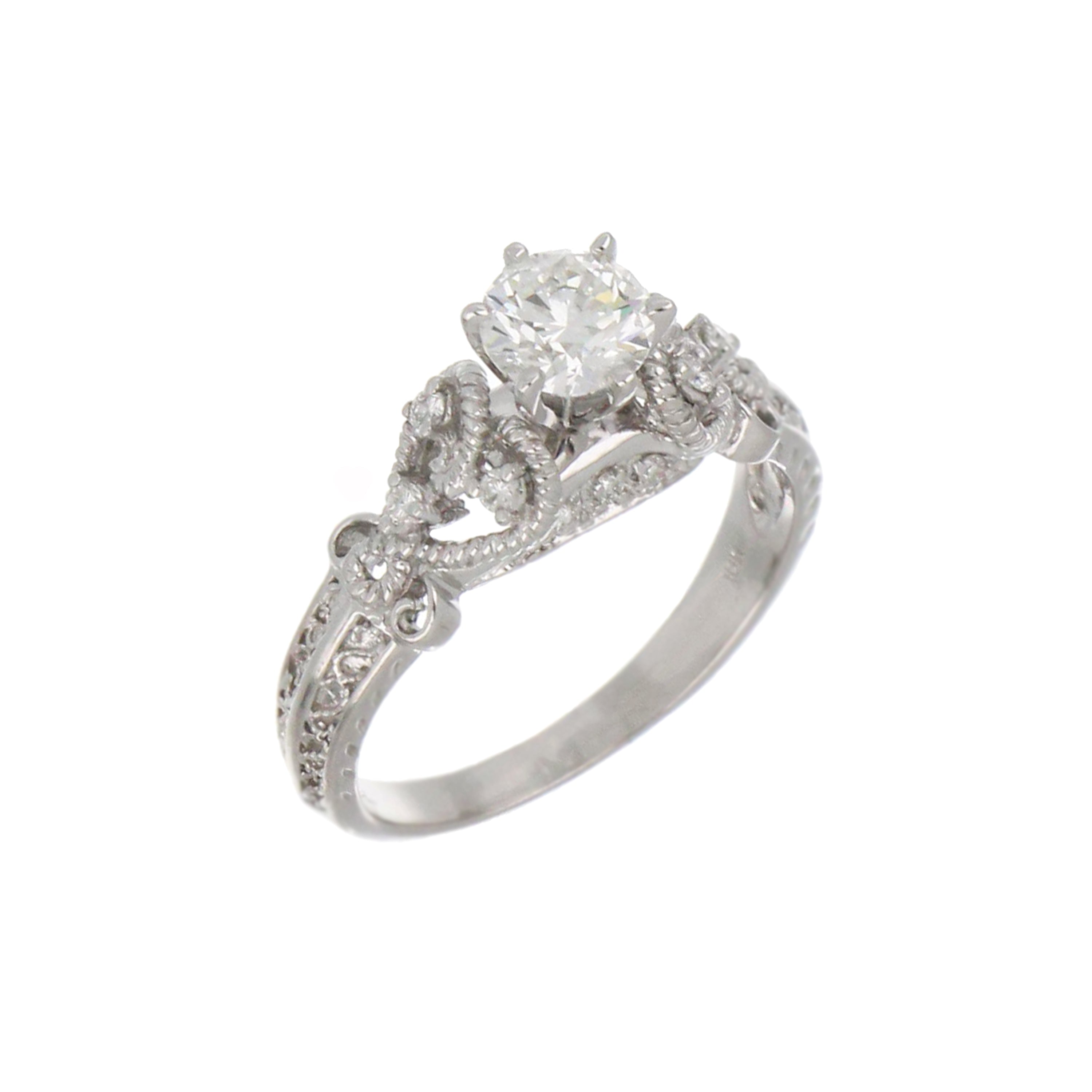 Top view of 18kt white gold ring featuring 1.12ct total round cut diamonds
