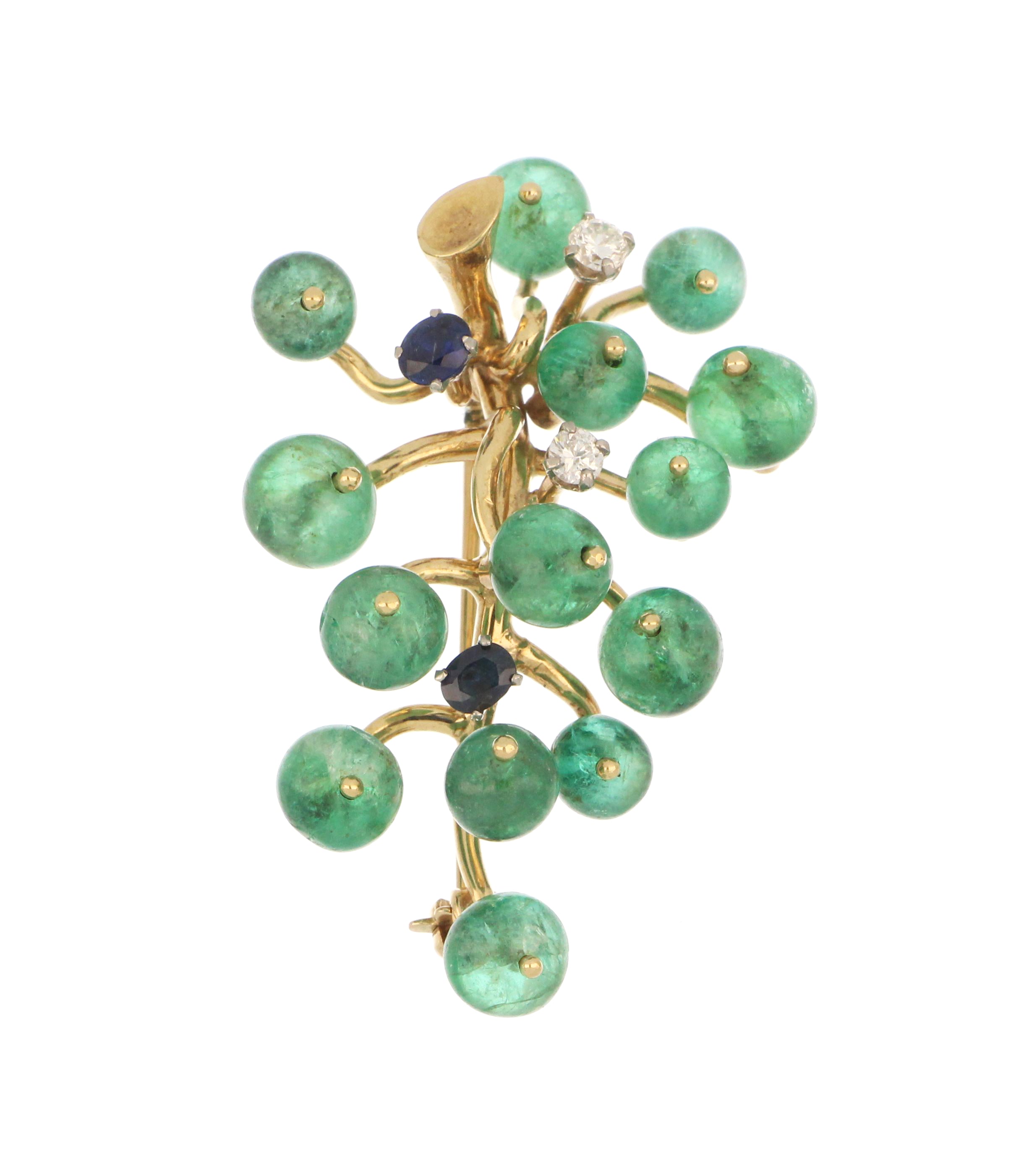 Close-up of 14kt yellow gold emerald brooch highlighting gemstones and intricate detailing