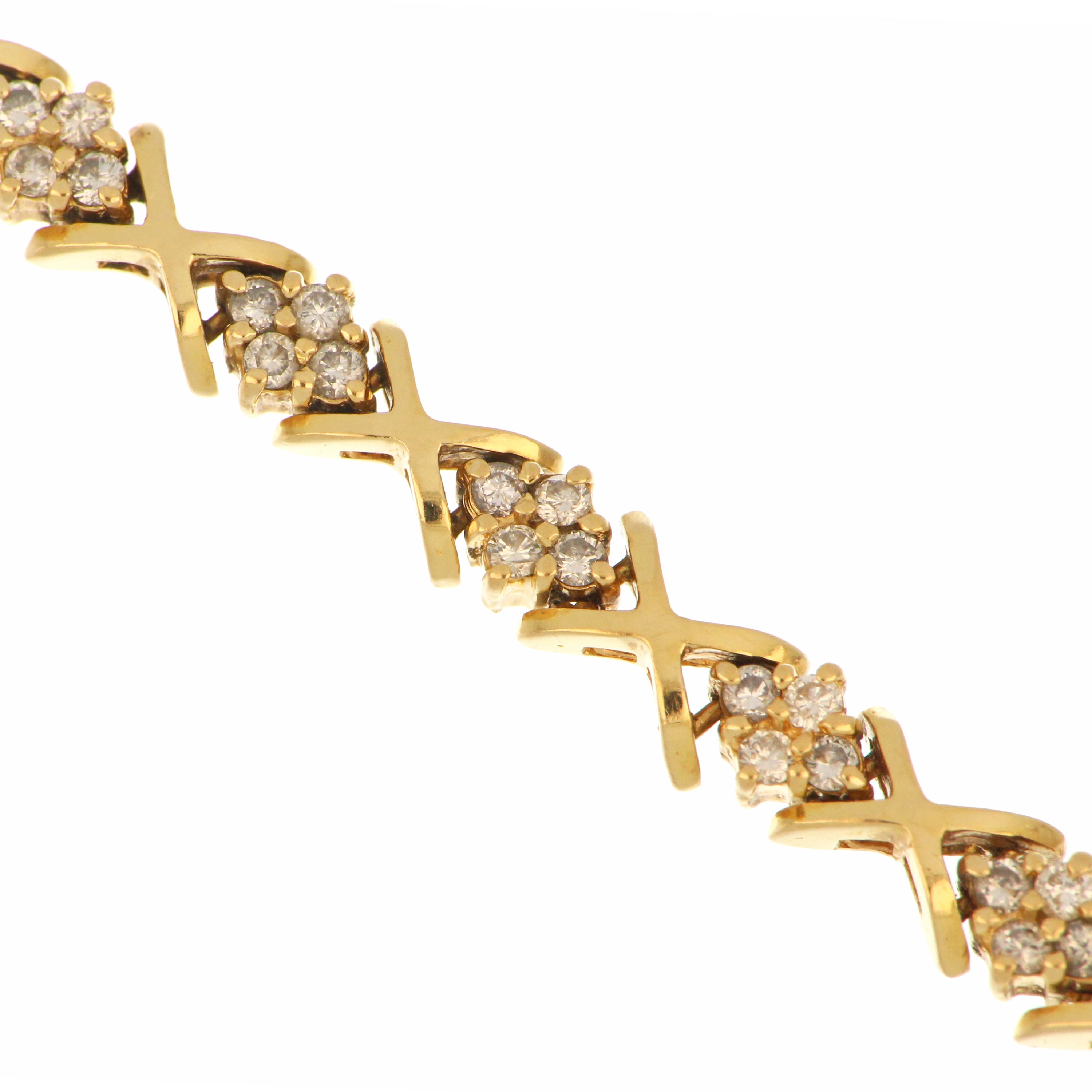 Side view of 18kt yellow gold diamond bracelet highlighting diamond settings and clasp detail