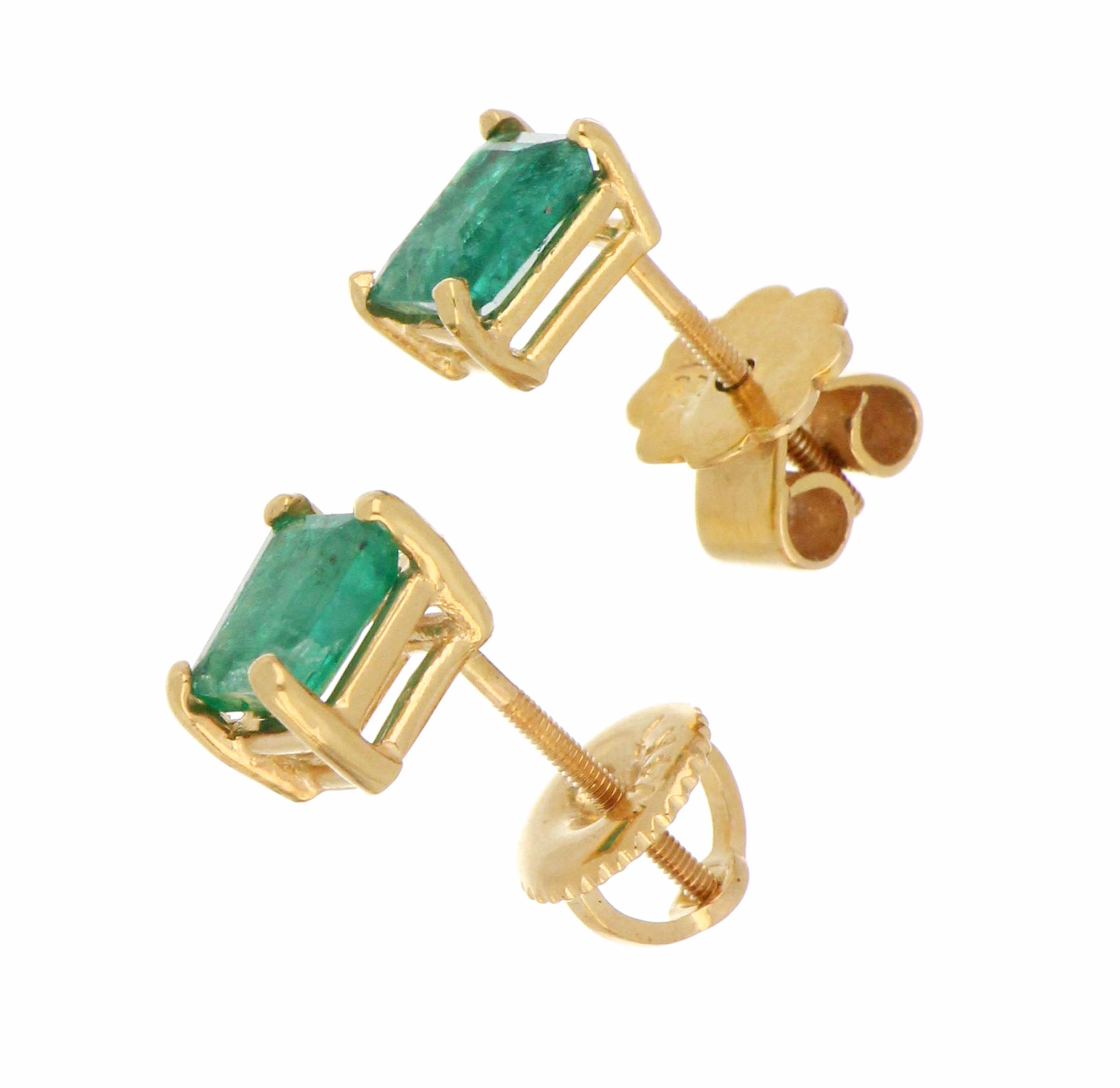 Close-up angle of 10kt yellow gold stud earring featuring rectangular baguette emerald, highlighting craftsmanship and brilliance