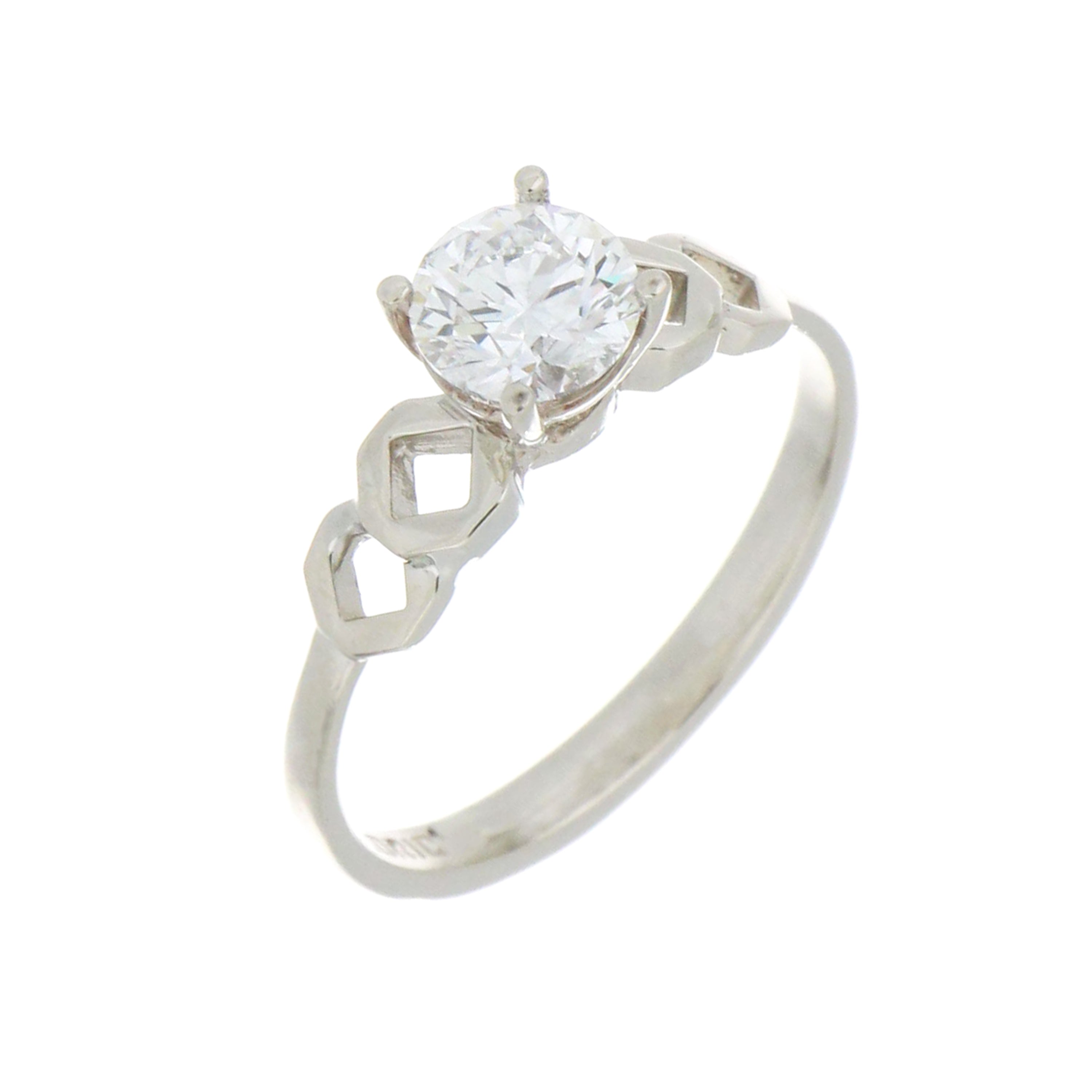 Close-up side profile of 14kt white gold solitaire ring highlighting the 4-claw diamond setting and smooth band