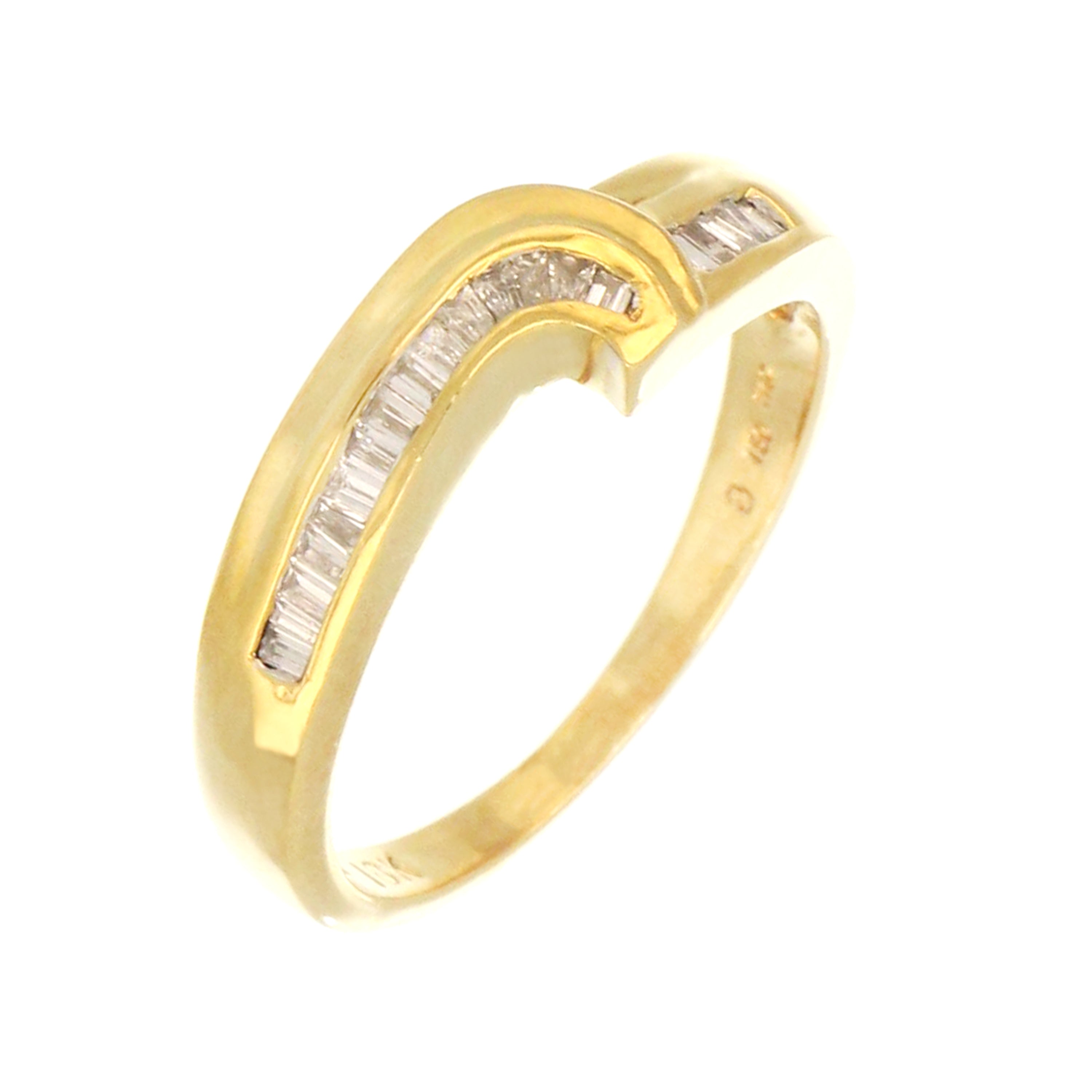 Side view of 18kt yellow gold diamond band showcasing thickness and baguette diamond setting detailed craftsmanship