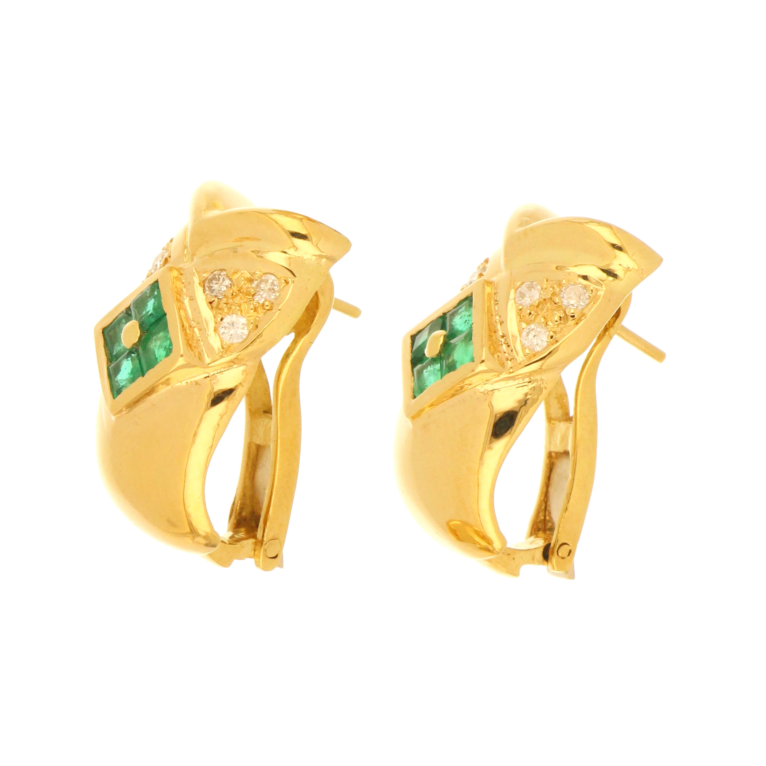 Side angle of 18kt yellow gold diamond and emerald owl earrings showcasing intricate detailing and gemstone arrangement