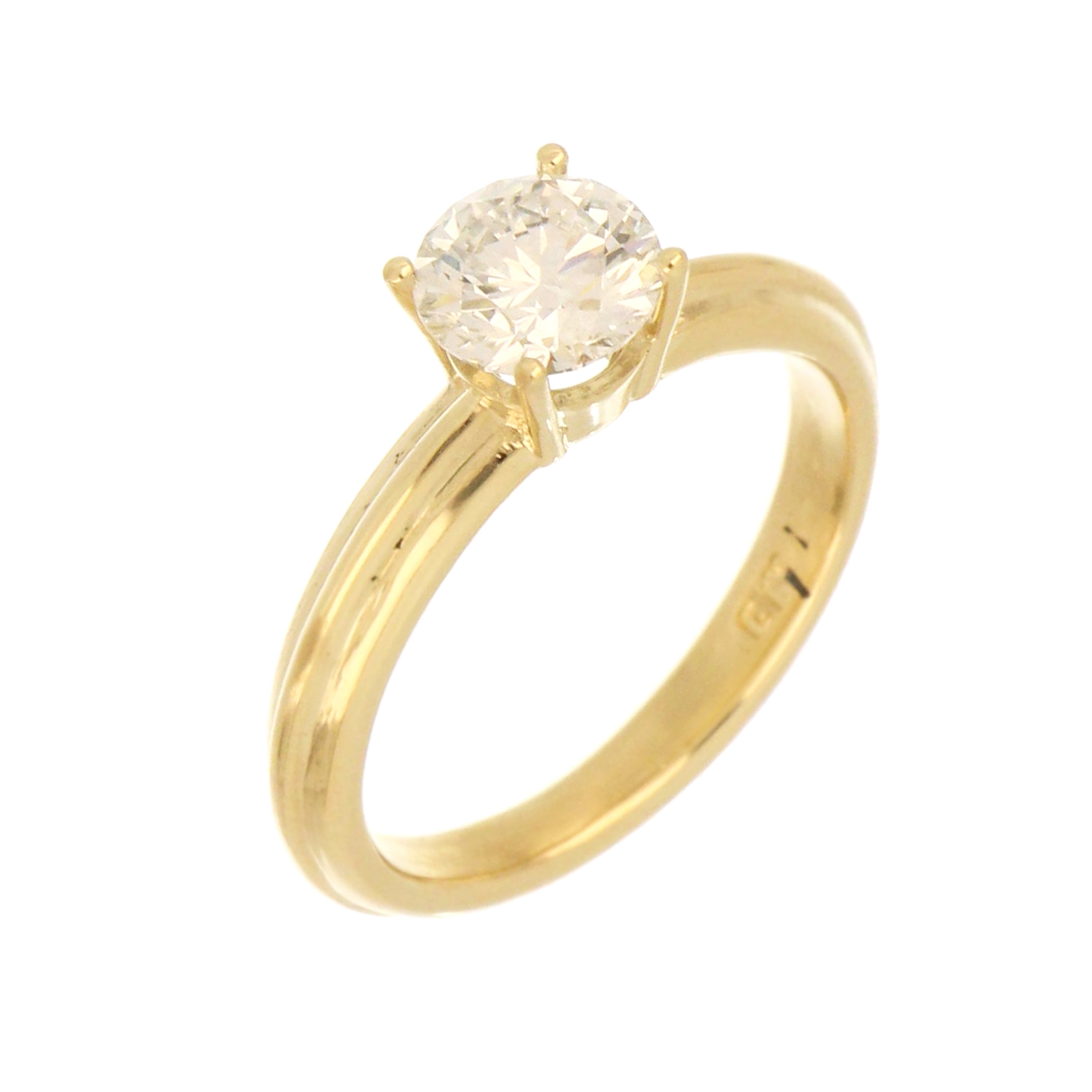 Side profile of 14kt yellow gold ring with 1.05ct round lab grown diamond in four claw setting, shimmering reflection