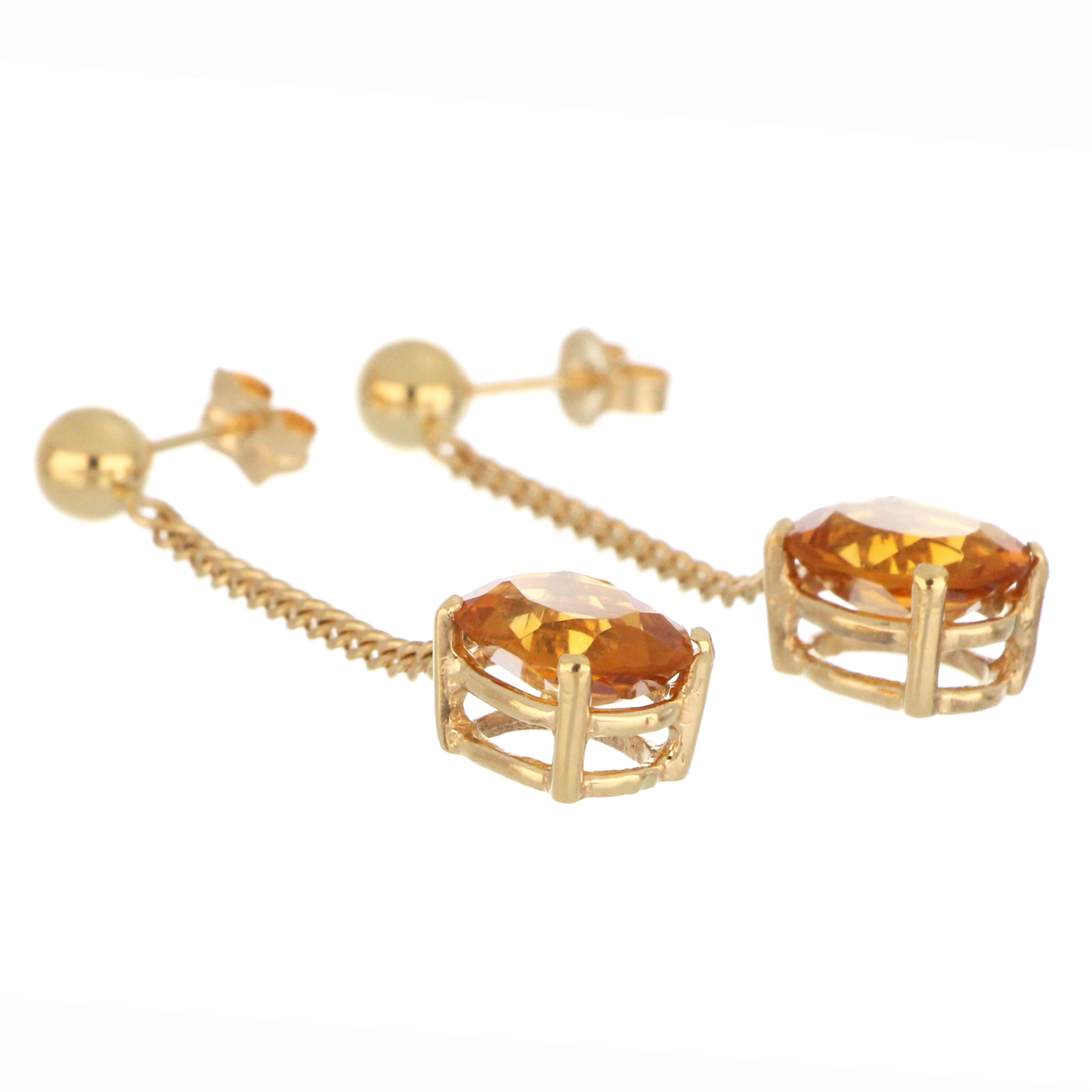 Close-up of 14kt yellow gold oval citrine dangle earrings highlighting vibrant orange-yellow gemstones and fine metalwork, vintage collectible style