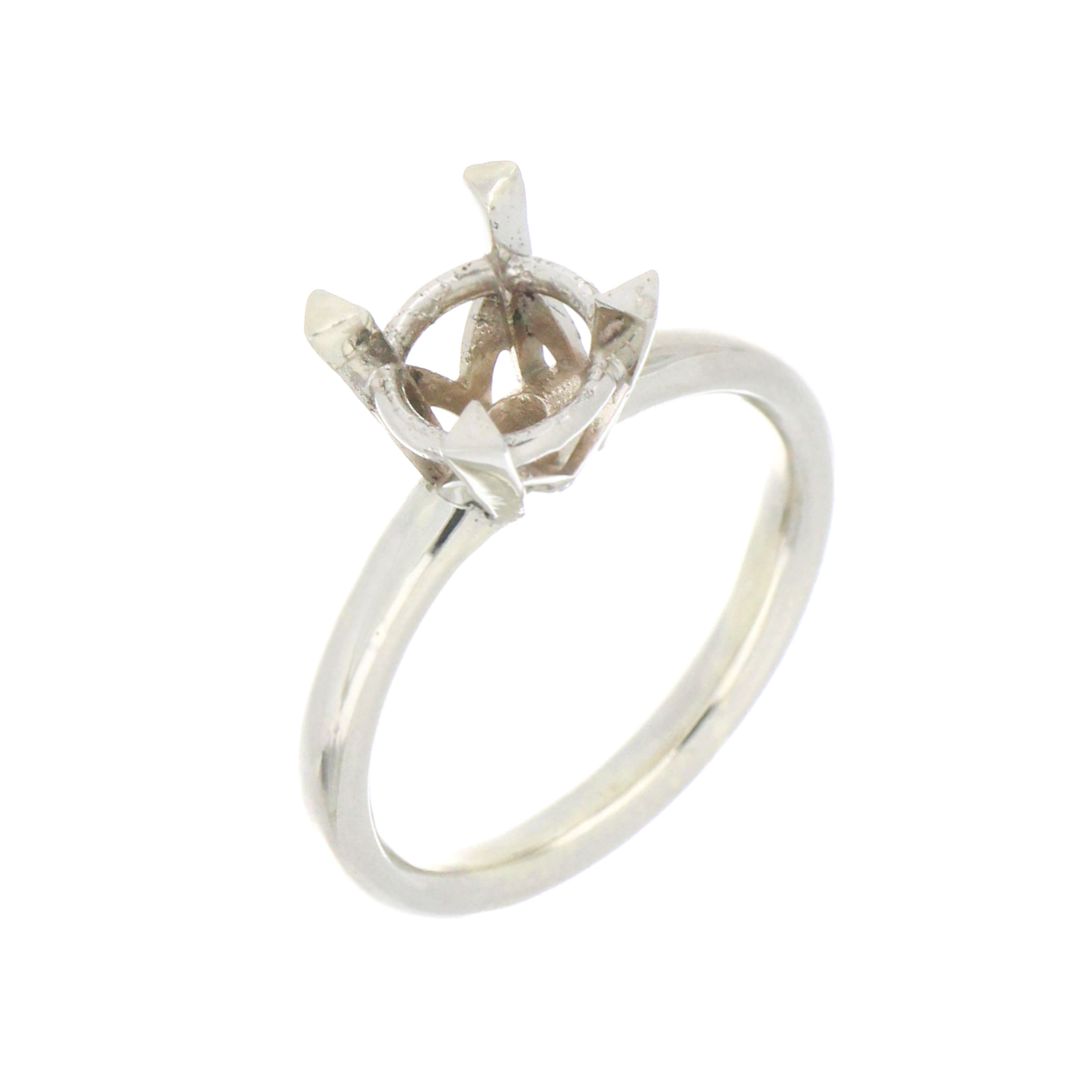 Side view of 14kt white gold solitaire engagement ring mounting on size 6.5, highlighting shank detail and claw setting