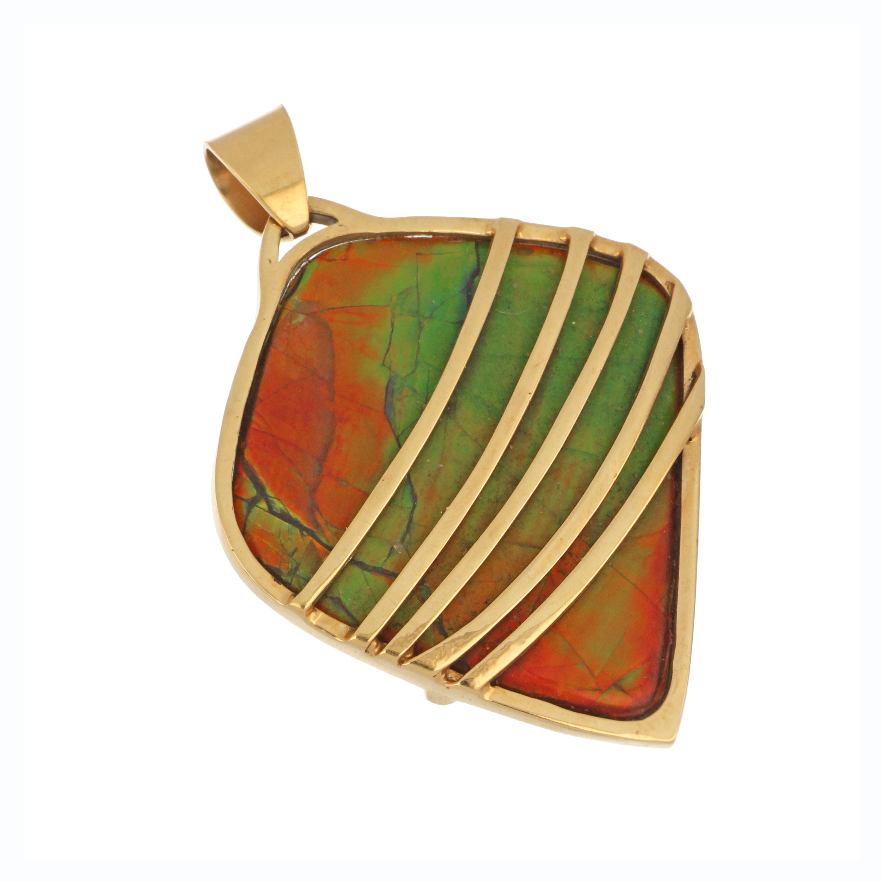 Close up of 14kt yellow gold ammolite pendant highlighting bezel setting and polished bail