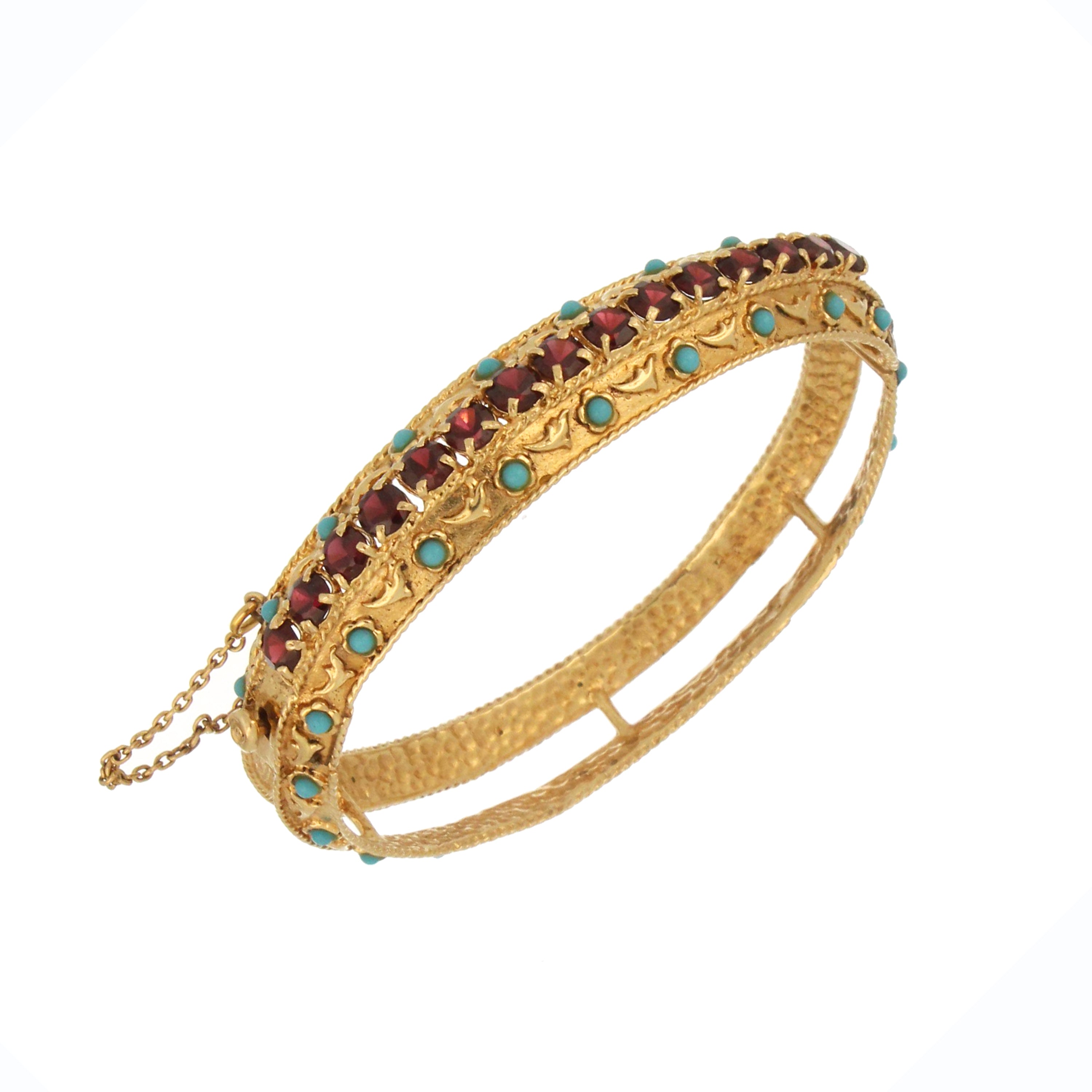 Side angle of collectible 10kt yellow gold bangle with 15 garnets and 42 turquoise beads, weighing 32.02 grams