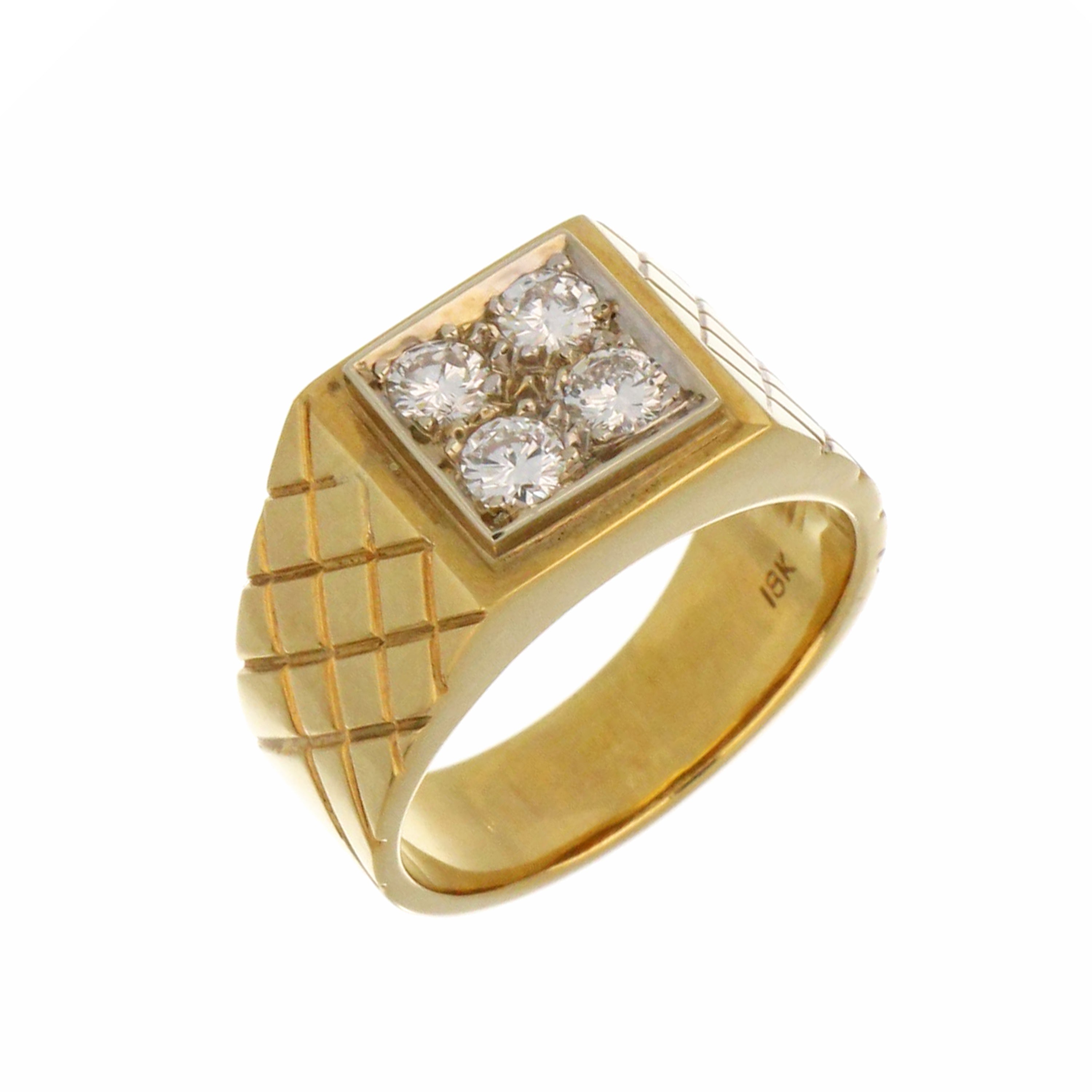 Close-up of 18kt yellow gold diamond ring highlighting four VS2 clarity G-H color diamonds set in claws