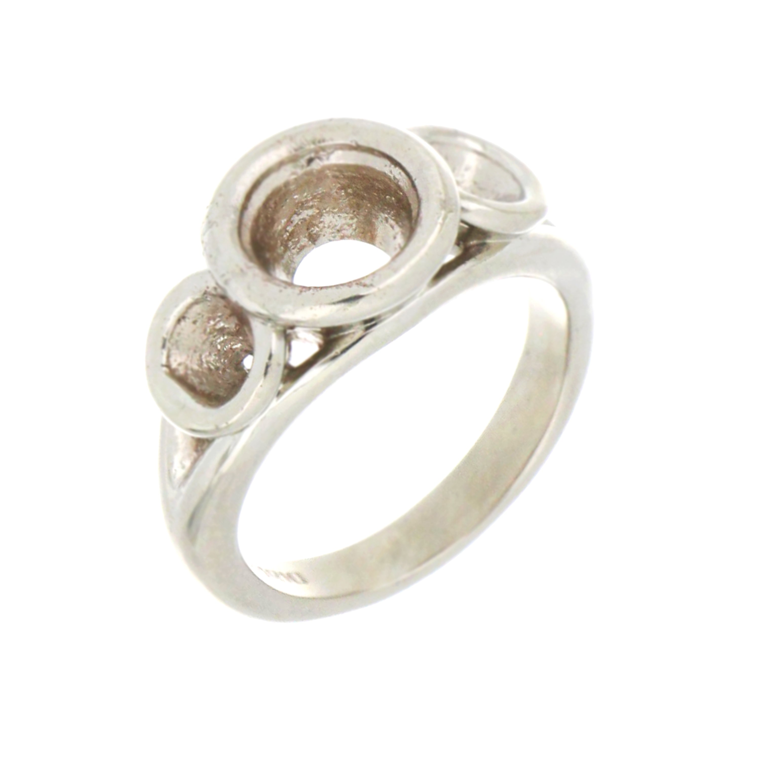 Side angle of 14kt white gold ring mounting highlighting bezel setting details for center and side stones