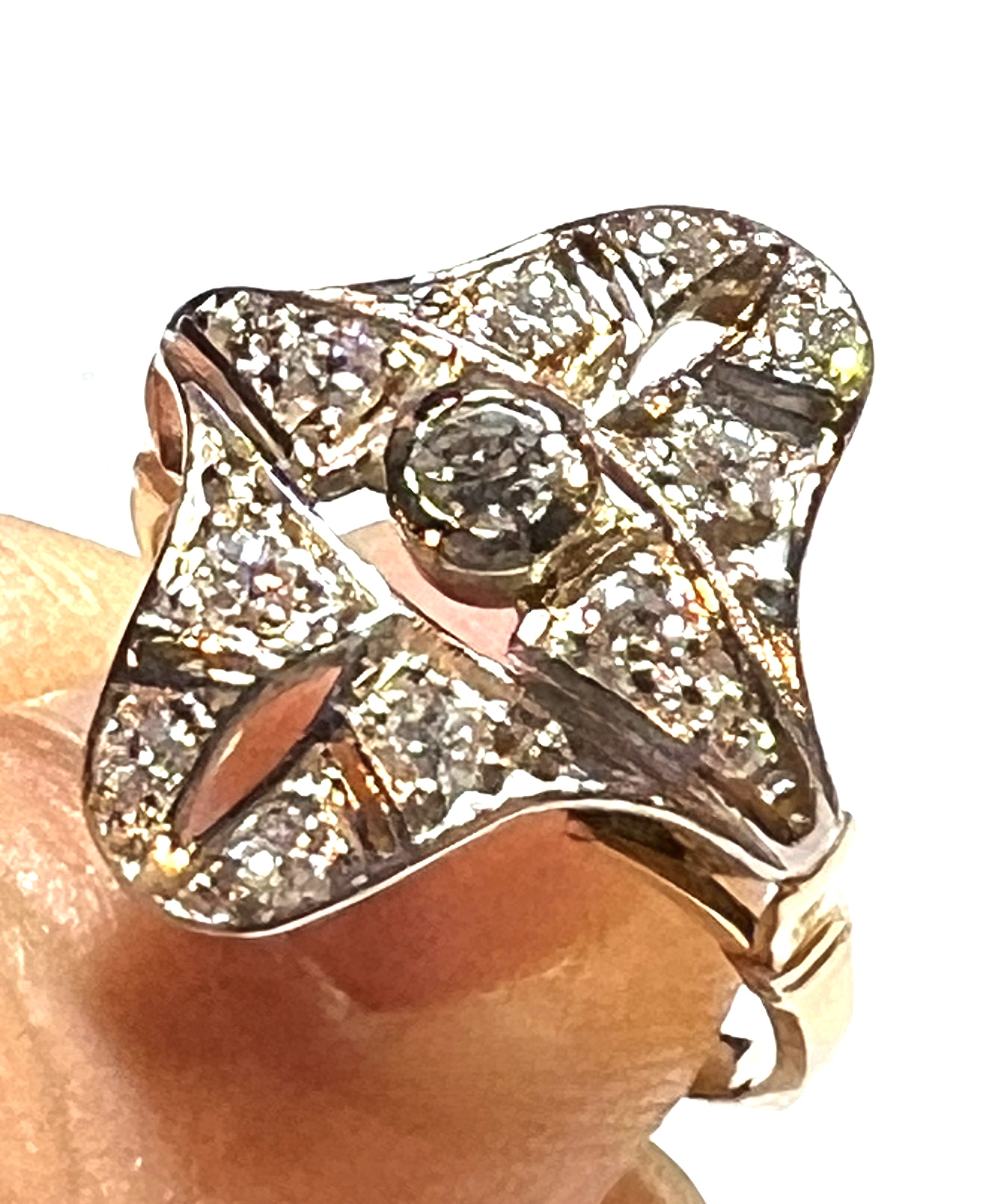 antique 18kt yellow gold diamond ring, displaying old brilliant cut center diamond and white gold settings under bright light