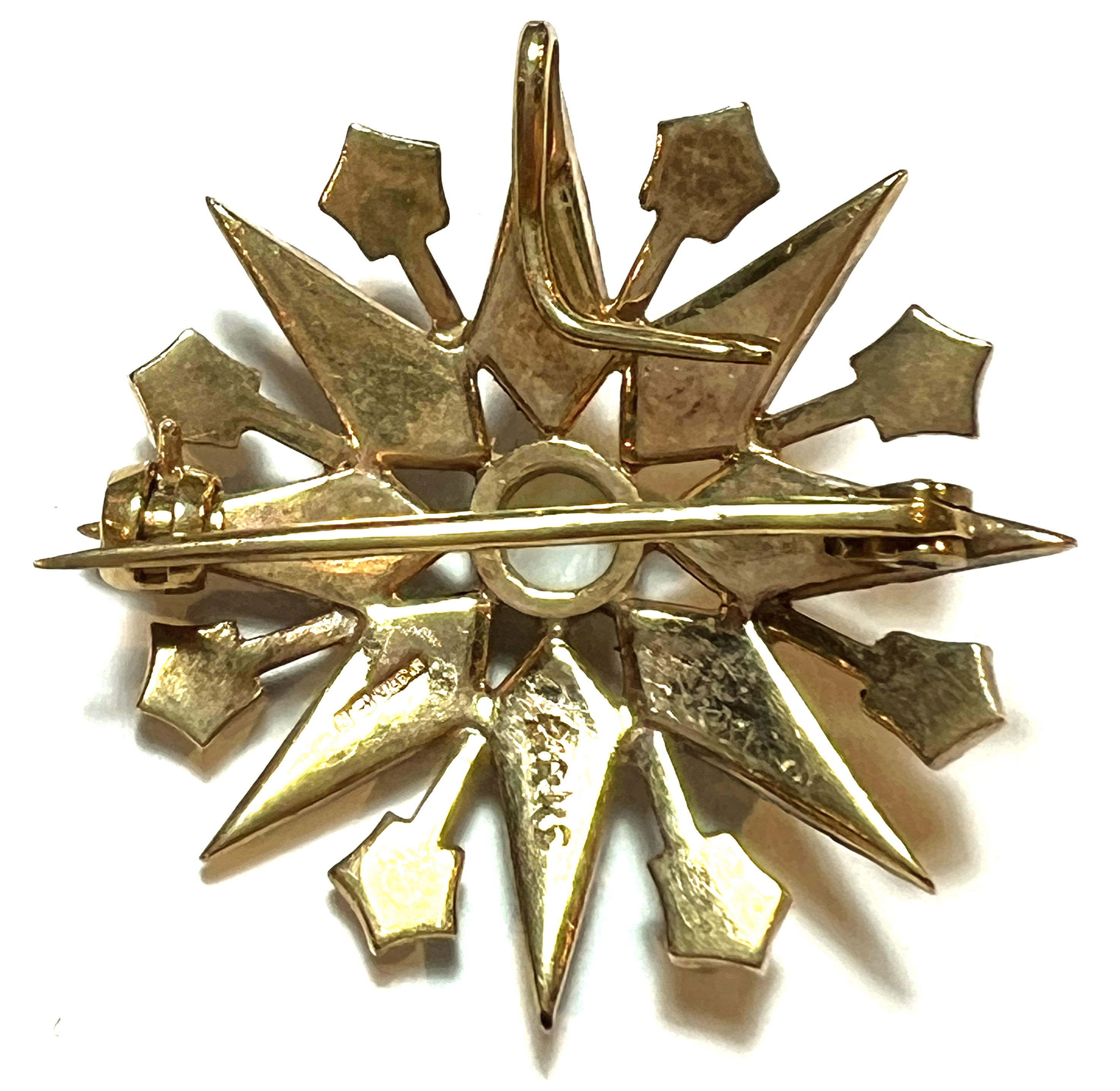 Side view of vintage 9kt yellow gold brooch showcasing detail and seed pearl setting, weighing 6.92 grams