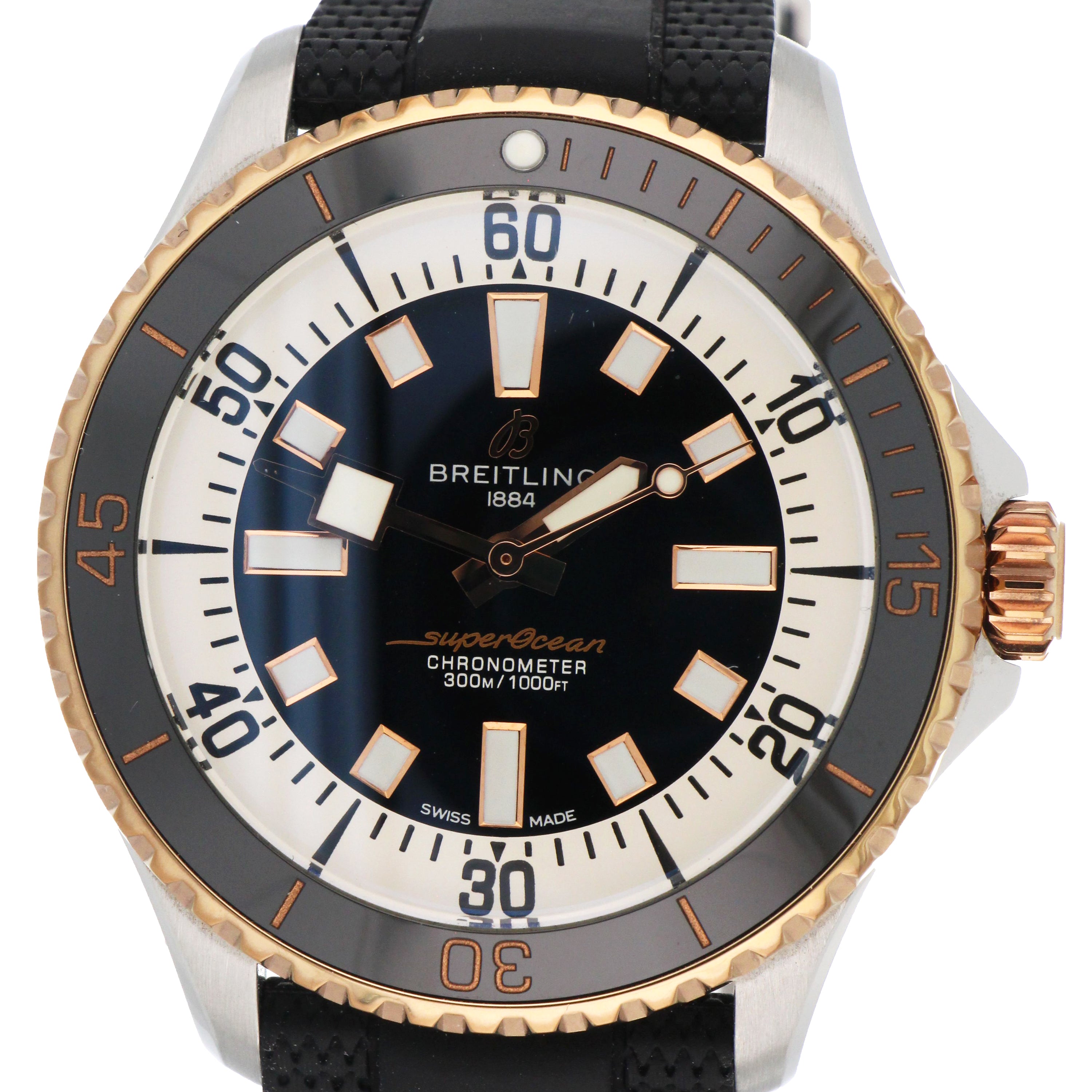 Close-up of Breitling SuperOcean black dial with automatic movement indication and luminous hands.