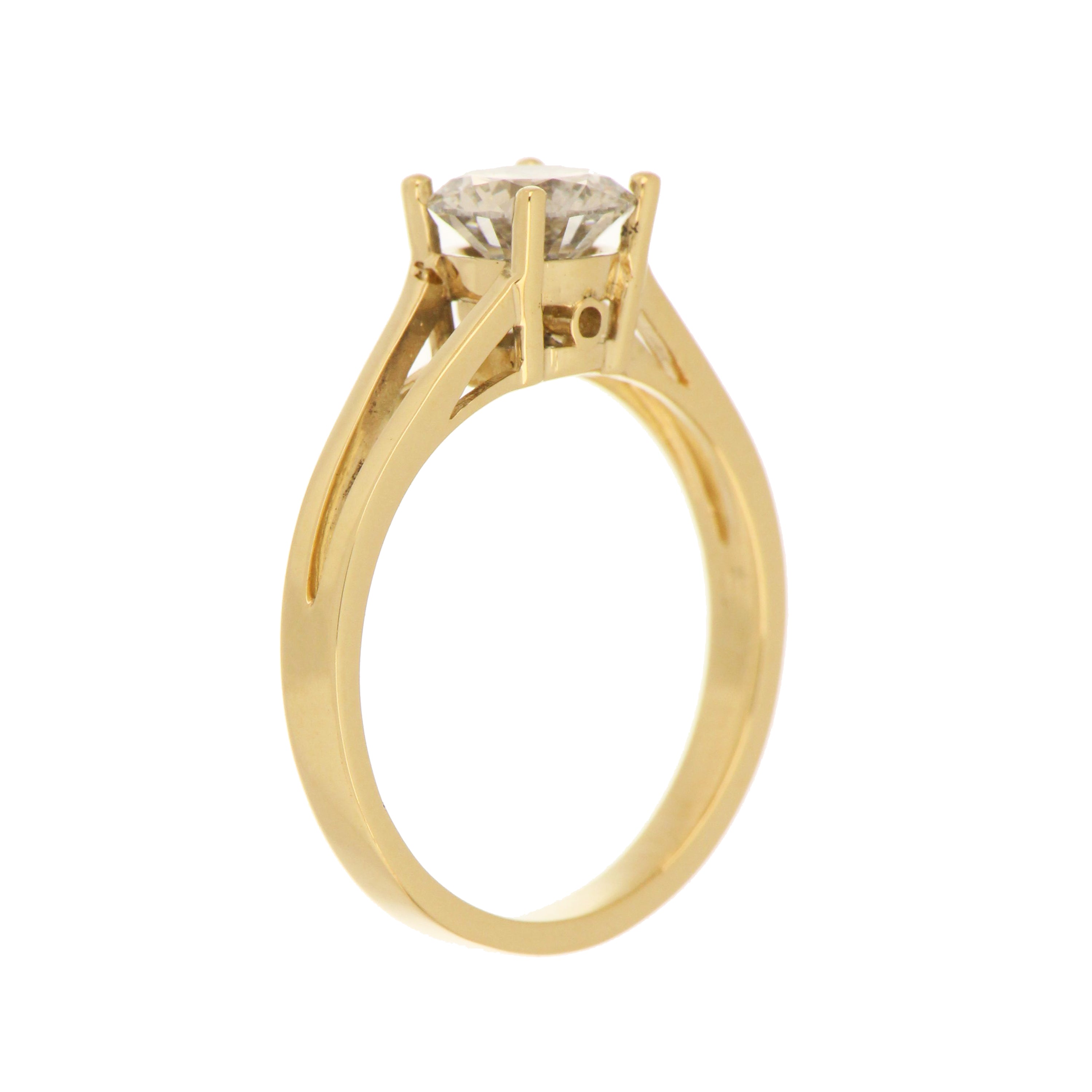 Top angle shot highlighting the round brilliant cut lab grown diamond with VVS2 clarity and F color in yellow gold ring