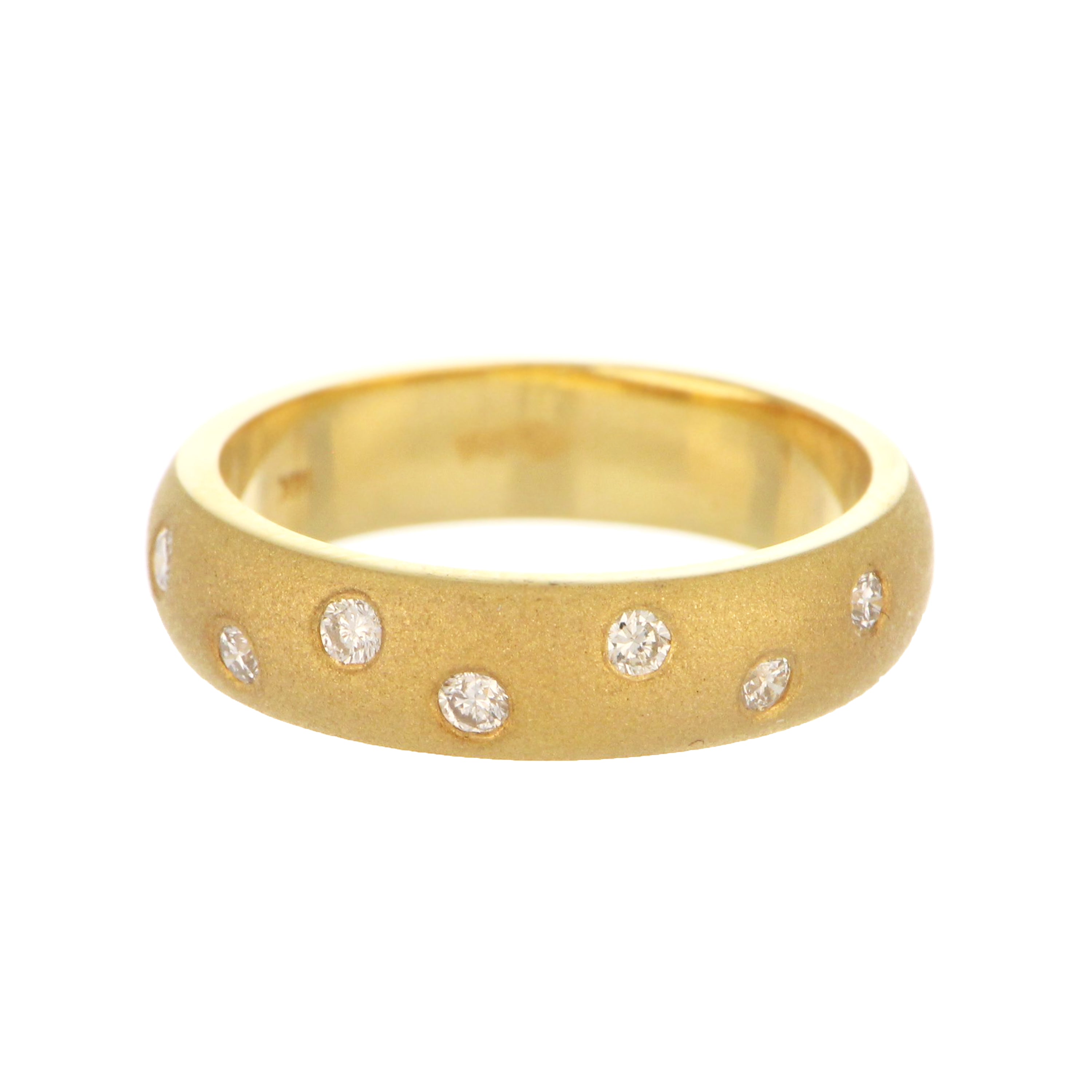 14kt yellow gold diamond band with 7 round cut diamonds in gypsy setting, front angle view
