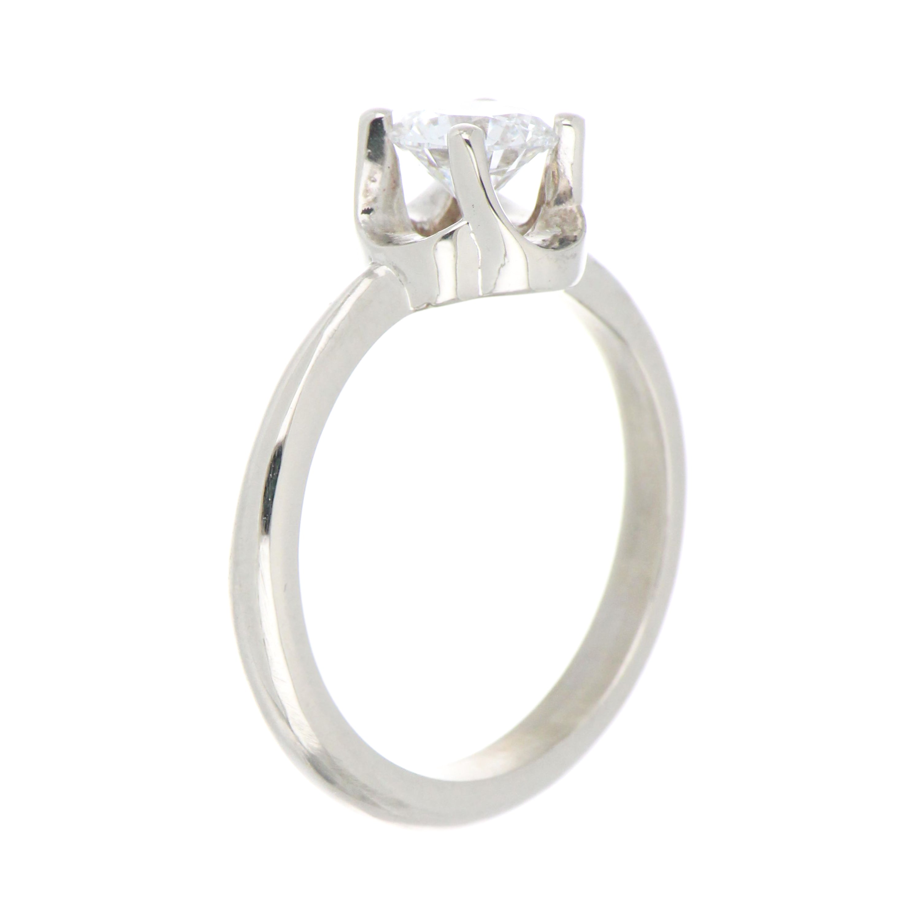 Top-down view of 14kt white gold engagement ring showcasing brilliant round diamond and polished white gold band