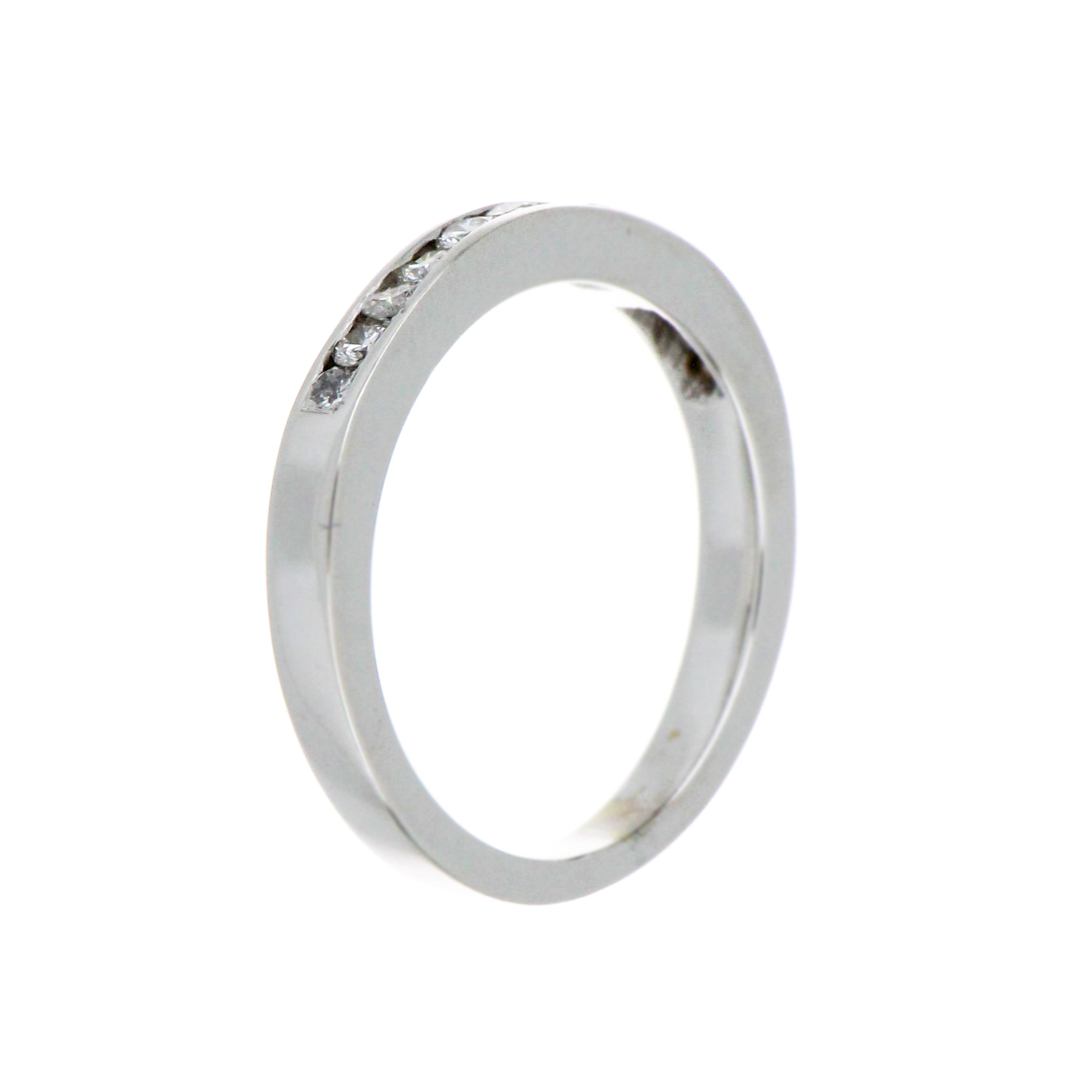 Close-up of 19kt white gold diamond band highlighting diamond clarity and polished metal surface weight 3.7 grams