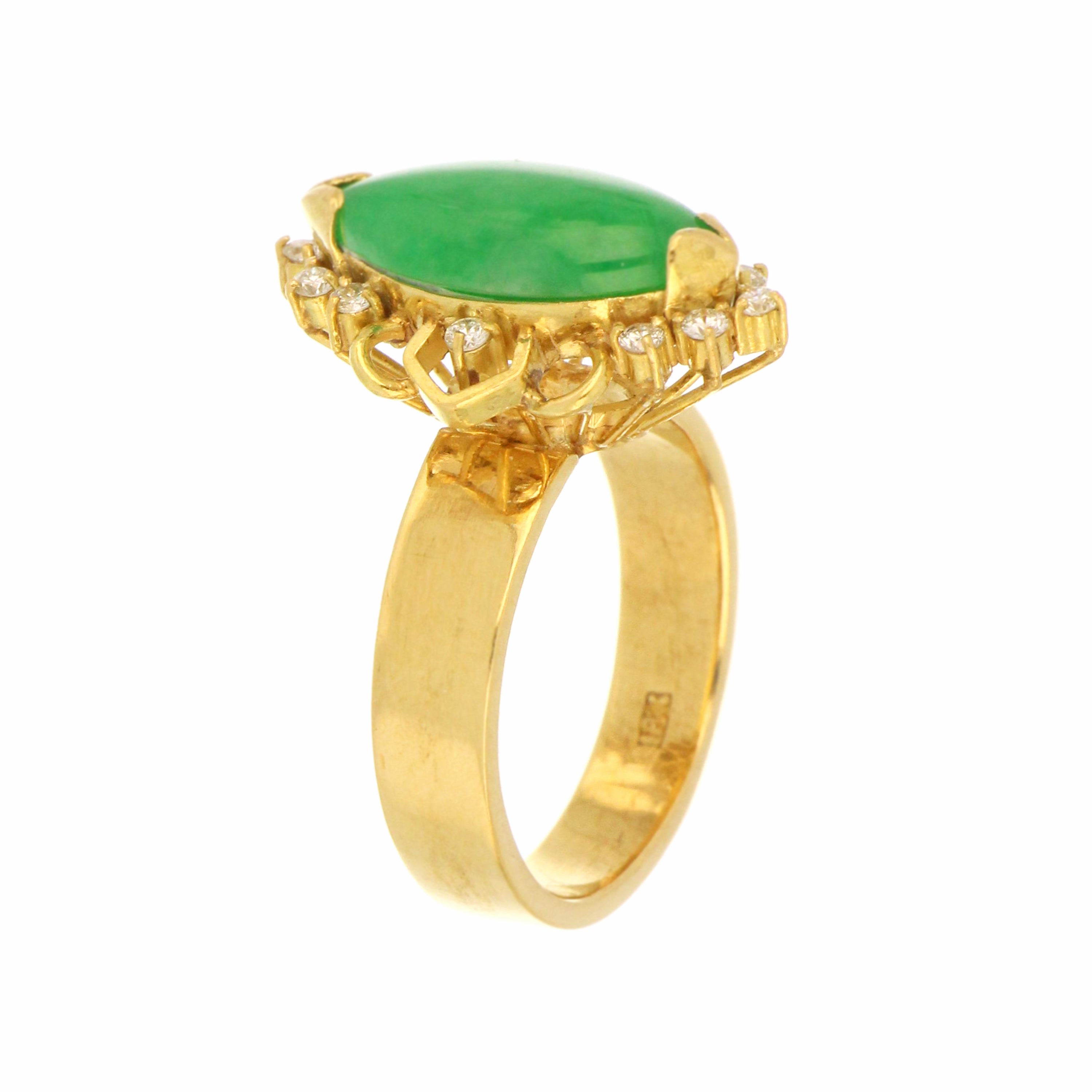 Close-up of marquise natural jadeite jade with 12 round brilliant cut diamonds in claw setting on 18kt yellow gold
