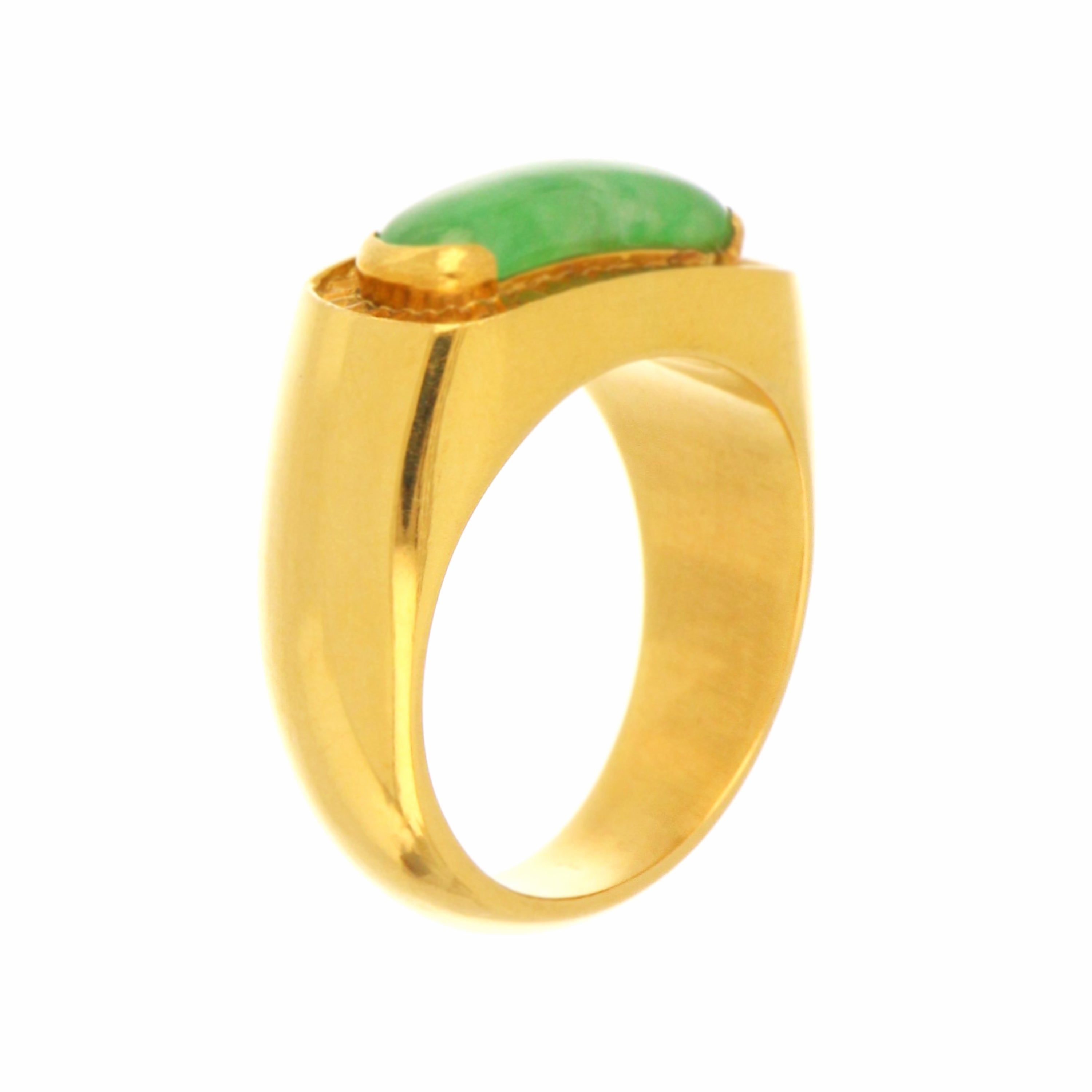 Detailed shot showing 18kt yellow gold shank and smooth green jadeite centerpiece on ring