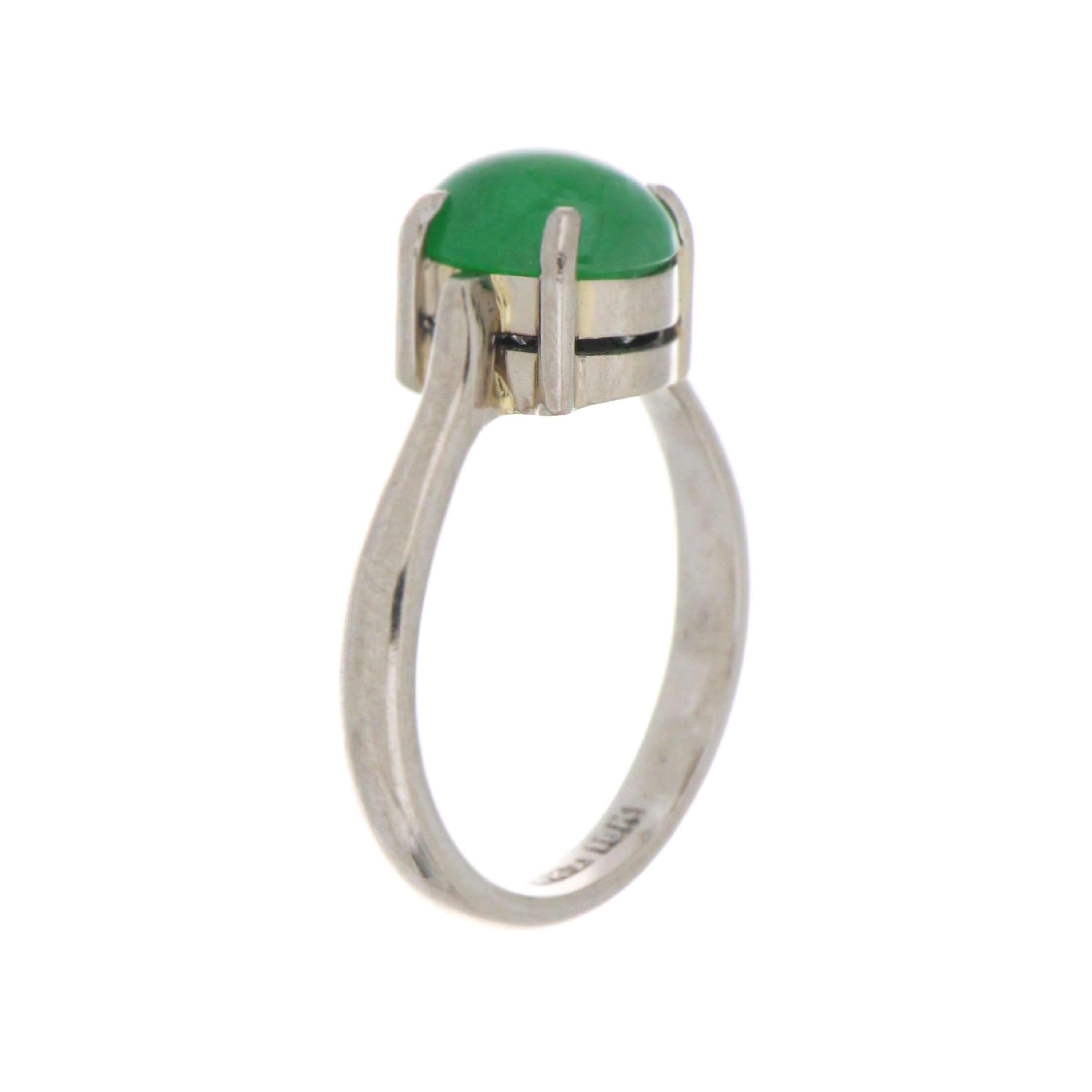 Side angle of 18kt white gold natural jadeite jade ring showcasing cabochon stone and highly polished band