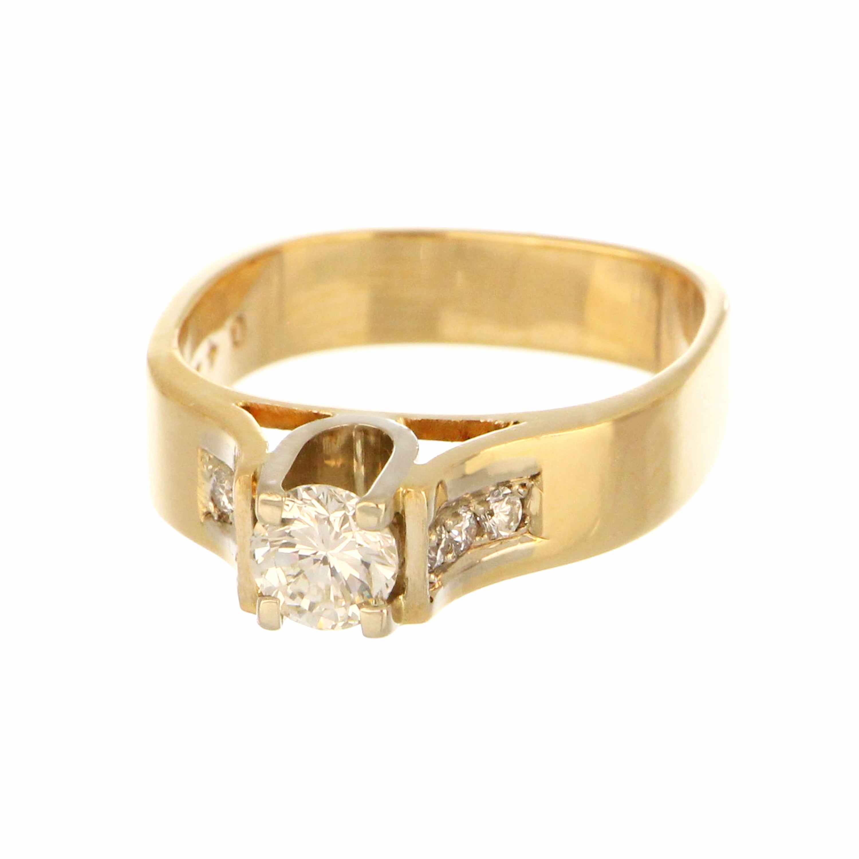 Top-down shot of 14kt yellow gold ring highlighting the center round brilliant diamond and detailed claw setting