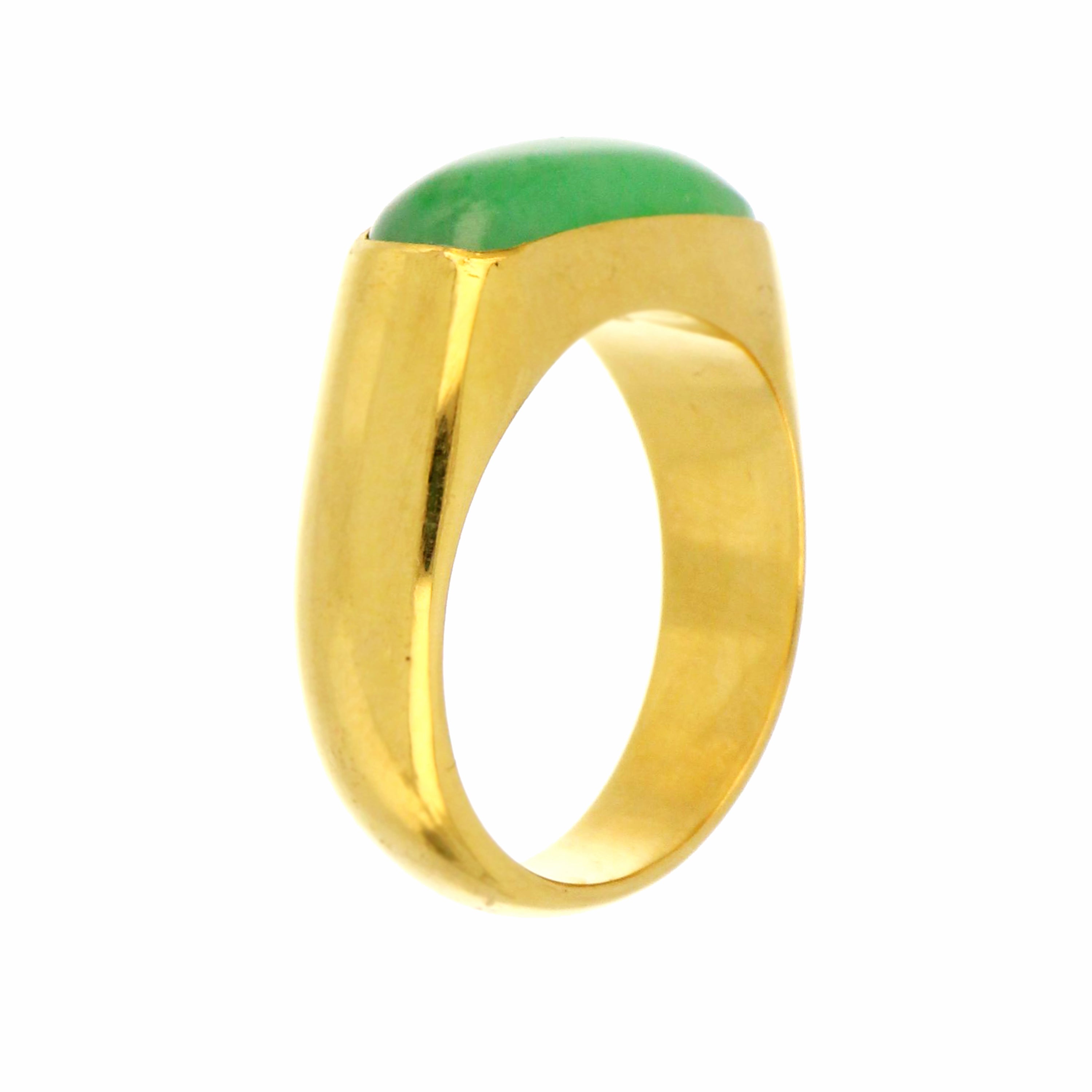 Close-up of natural jadeite jade stone in saddle shape set on 18kt yellow gold polished ring band