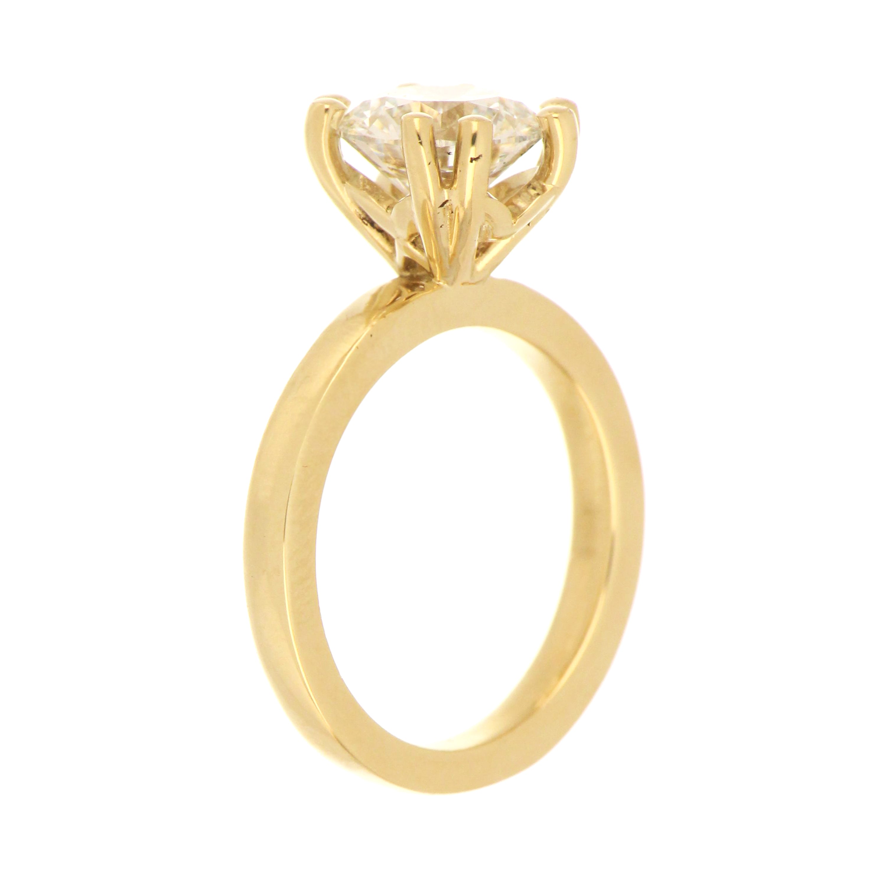 Close-up detailed view of 1.52 carat round lab grown diamond on 14kt yellow gold ring